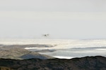 An LC-130 "Skibird" with the 109th Airlift Wing from Stratton Air National Guard Base, Scotia, N.Y., returns to Kangerlussuaq, Greenland, on June 29, 2014, from a mission at Summit Camp. Two LC-130s and 70 Airmen from the Wing recently completed the fourth rotation of the 2014 Greenland season. The unit flies supply and refueling missions to various camps in support of the National Science Foundation and also trains for the Operation Deep Freeze mission in Antarctica.