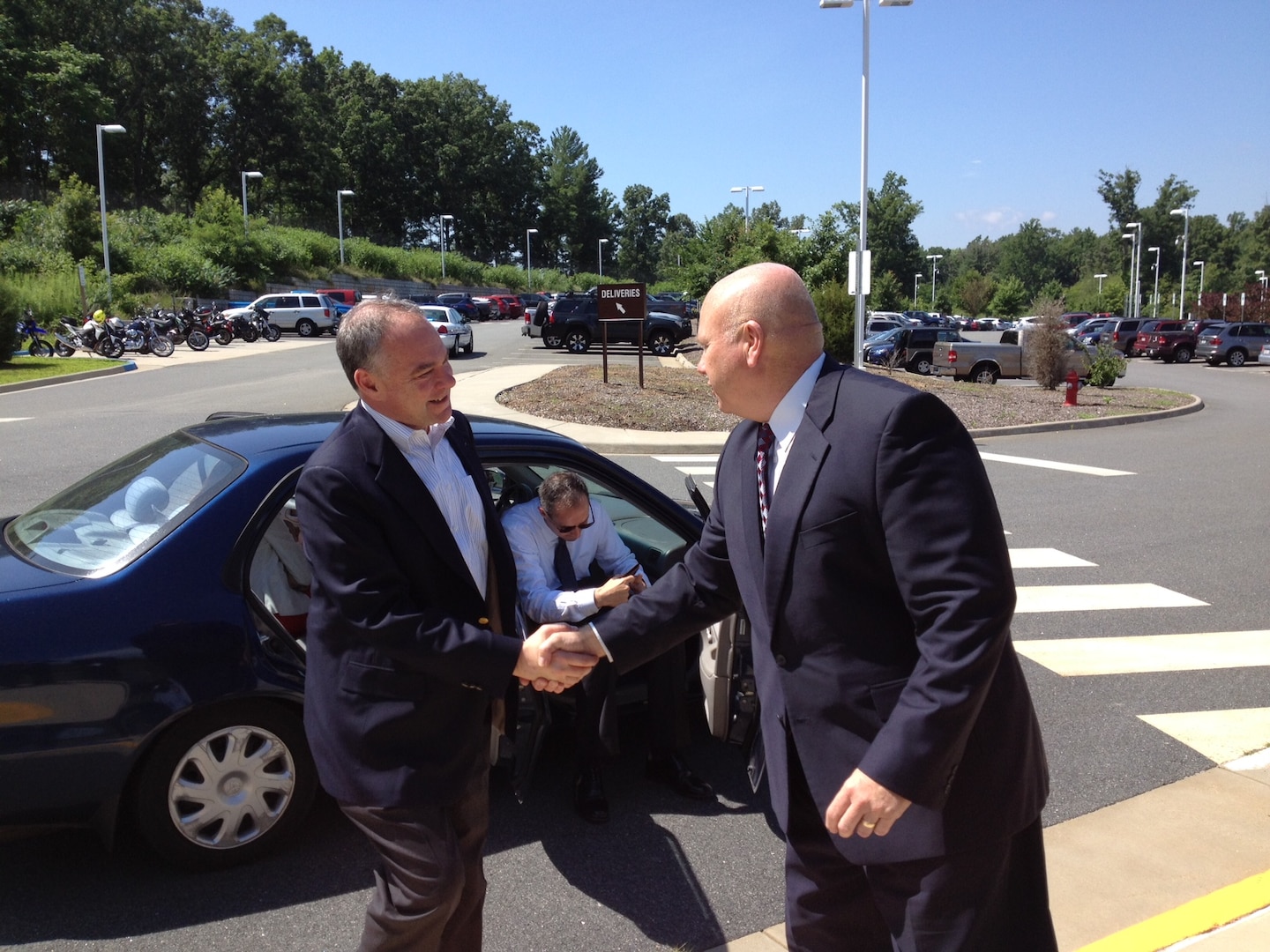 Rivanna Station Chief Thomas Francis greets Sen. Tim Kaine upon his arrival to the DIA facility. 