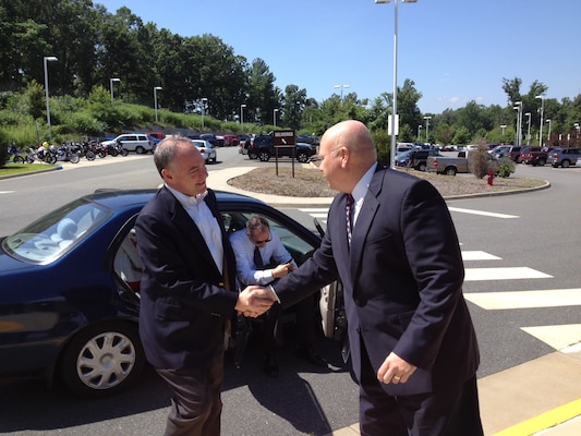 Rivanna Station Chief Thomas Francis greets Sen. Tim Kaine upon his arrival to the DIA facility. 