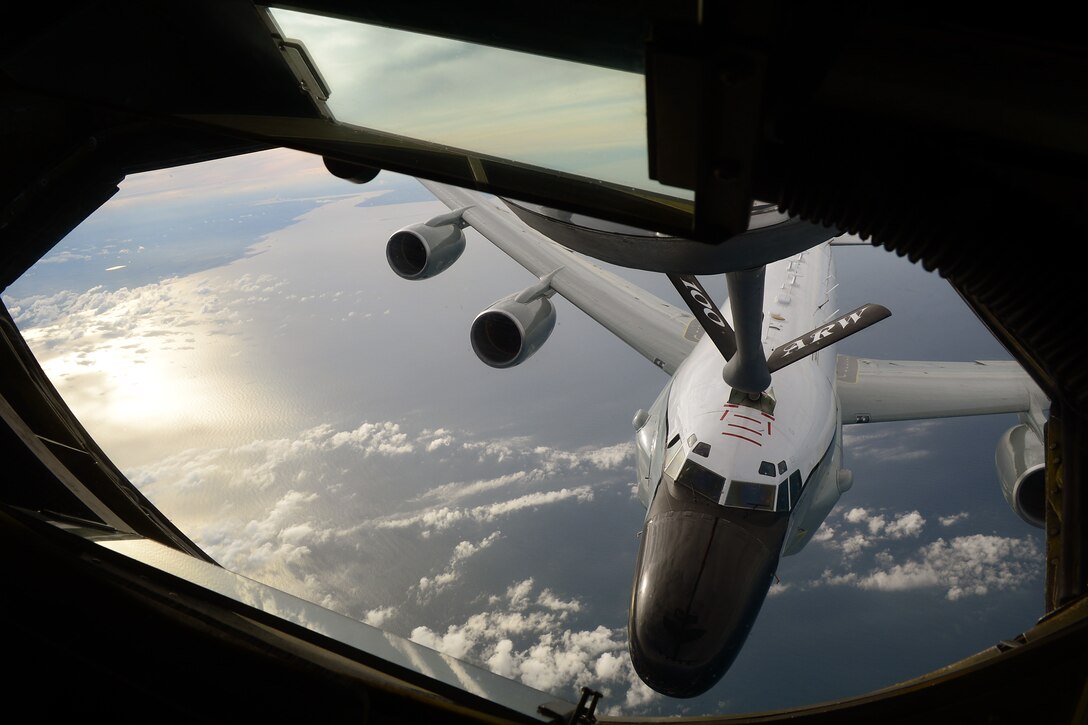A KC-135 Stratotanker refuels a Royal Air Force RC-135V/W Rivet Joint June 26, 2014, off the coast of England. This was the first time a tanker belonging to the 100th Air Refueling Wing refueled a RAF RC-135. The KC-135 is based at RAF Mildenhall, England. (U.S. Air Force photo/Airman 1st Class Jonathan Light)
