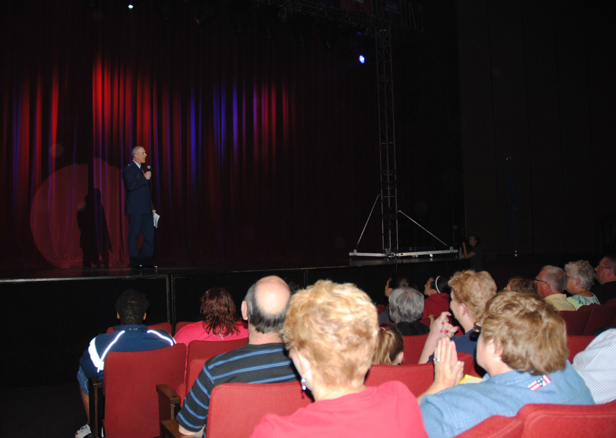 Col. Paul Bauman, 319th Air Base Wing commander, greeted everyone attending the Air Force's Tops in Blue performance held June 29, 2014, at the Chester Fritz Auditorium on the campus grounds of the University of North Dakota in Grand Forks, N.D. The colonel was the evening's host. He thanked the Grand Forks community for their tremendous support for the base and the Warriors of the North at Grand Forks AFB. (U.S. Air Force photo/Staff Sgt. Luis Loza Gutierrez)