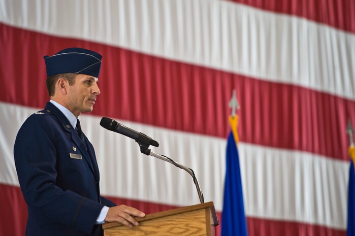 Col. Barry Cornish, 99th Air Base Wing outgoing commander, delivers his farewell speech at the change of command ceremony, June 27, 2014, Nellis Air Force Base, Nev. Cornish was responsible for three groups and 14 squadrons providing installation support for operational testing, tactics development, and advanced training in air, space, cyberspace as well as global Remotely Piloted Aircraft operations. He also proved medical, contracting, engineering, supply, logistics, communications, law enforcement, environmental, security, and transportation for more than 10,000 assigned personnel and 313,000 dependents, retirees, and veterans. (U.S. Air Force photo by Senior Airman Christopher Tam)