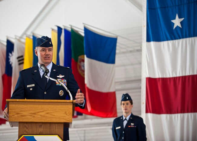 Col. Richard Boutwell, 99th Air Base Wing commander, delivers his speech after assuming command of the 99th ABW, at the Thunderbird hangar, June 27, 2014, Nellis Air Force Base, Nev. Boutwell entered the Air Force in 1991 as a distinguished graduate of the Troy State University Reserve Officer Training Corps program. He has served as an instructor pilot, flight examiner, and operations officer. (U.S. Air Force photo by Airman 1st Class Thomas Spangler)