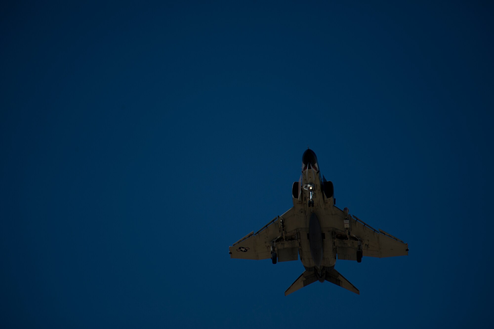 Lieutenant Colonel Brian Swyt, 82nd Aerial Targets Squadron Detachment 1 commander, flies an F-4 Phantom to monitor the exercise and act as a guide during the QF-16 landing process to ensure an accurate landing at Holloman Air Force Base, N.M., June 25. A QF-16 took part in an operational live fire exercise as part of the aircrafts test flight program before the beginning of production at the Boeing facility in Cecil Field, Jacksonville, Fla. in late 2014. (U.S. Air Force photo by Airman 1st Class Aaron Montoya / Released)