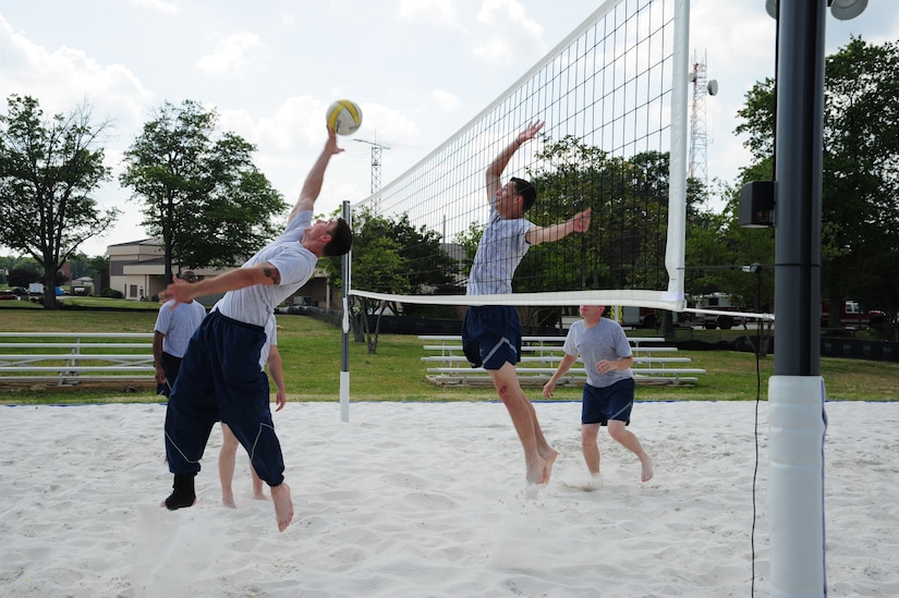 Airmen enjoy their new volleyball court built for dorm residents at Joint Base Andrews, Md., during a friendly game of volleyball, June 26, 2014. (U.S. Air Force photo/Airman 1st Class Joshua R. M. Dewberry)