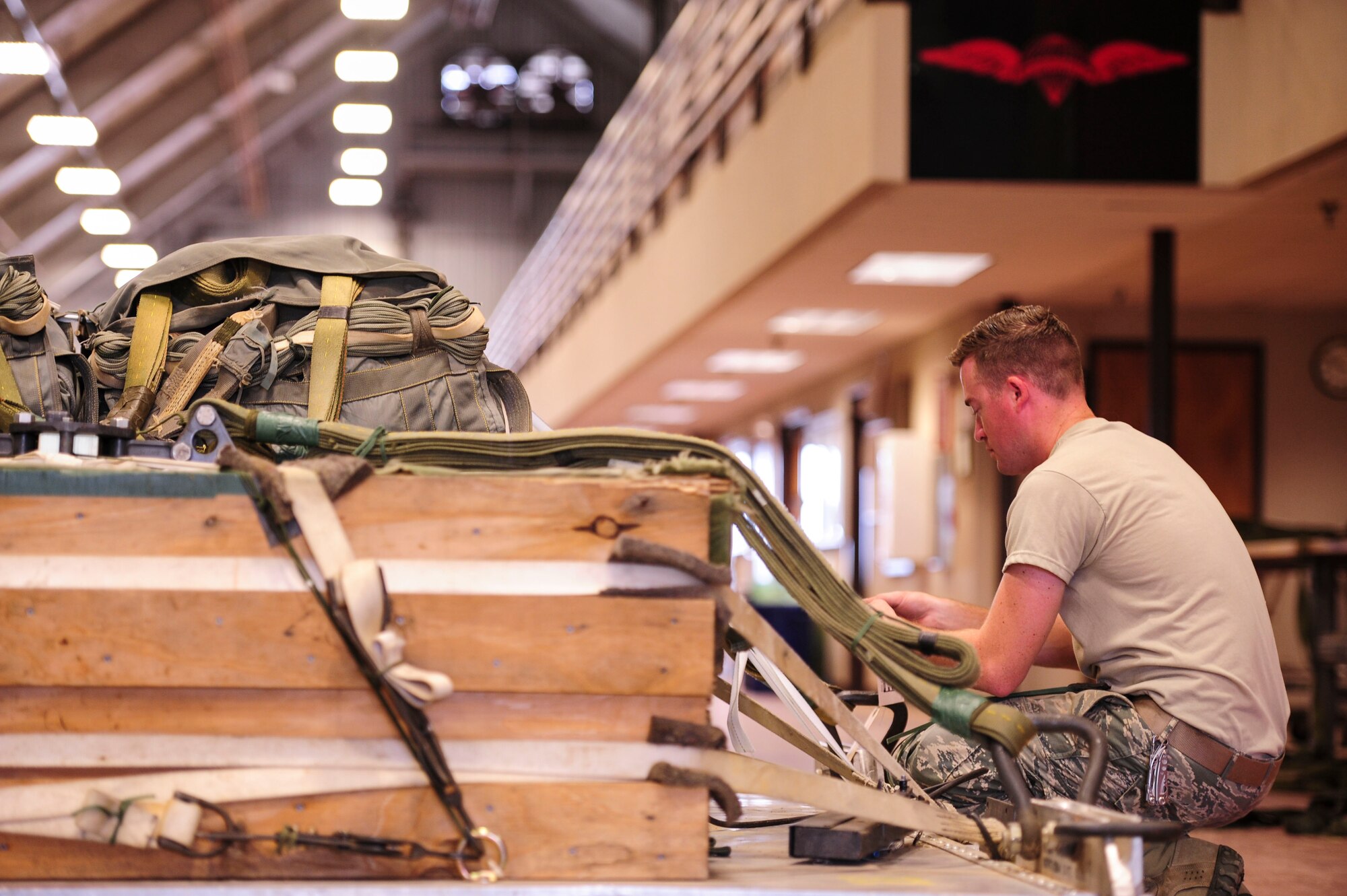 Senior Airman Mitchell Sellers, a 19th Logistics Readiness Squadron aerial delivery journeyman, rigs a heavy equipment platform June 27, 2014, at Little Rock Air Force Base, Ark. Each platform is inspected by loadmasters before being loaded onto an aircraft. (U.S. Air Force photo by Senior Airman Kaylee Clark)