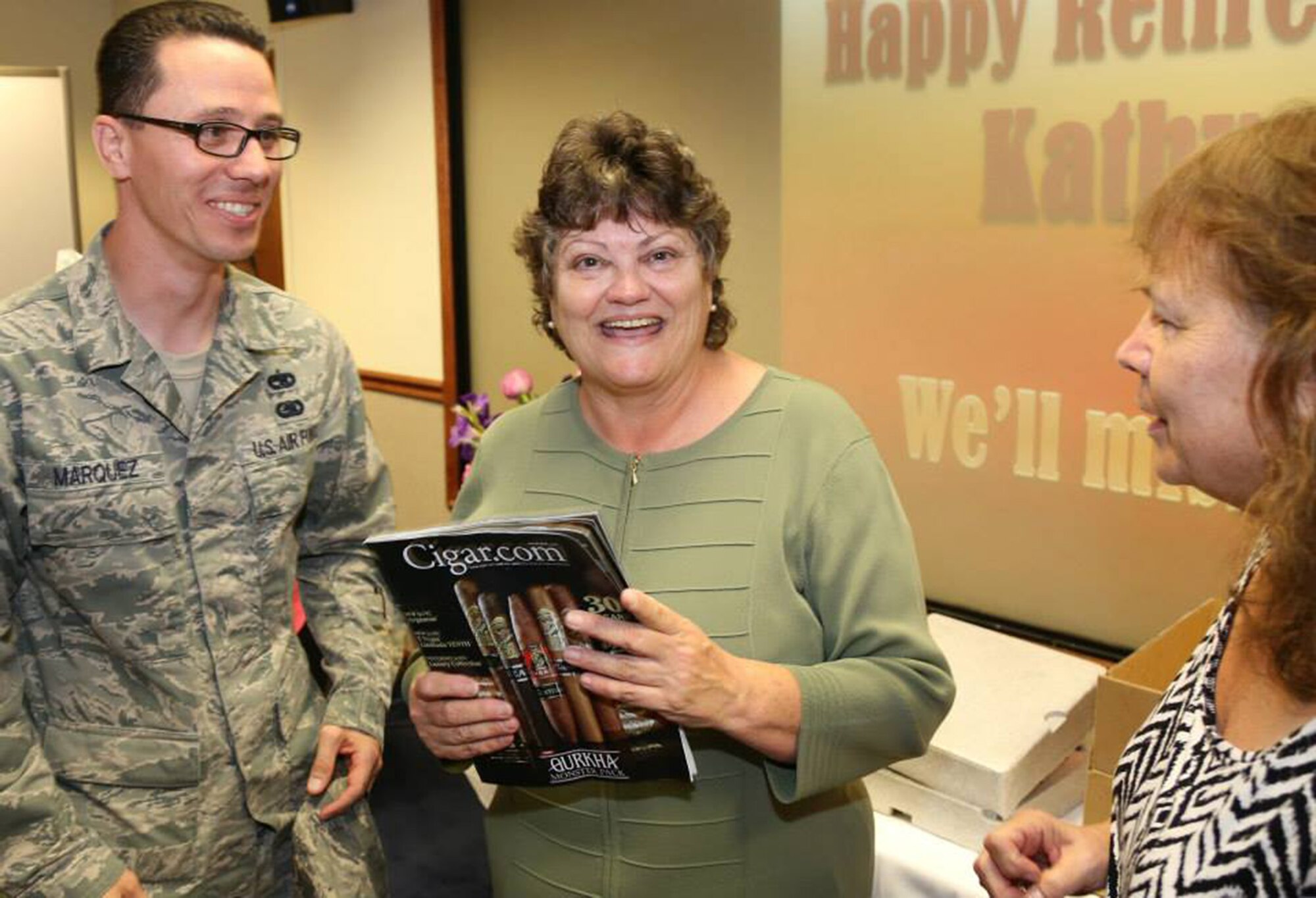 TRAVIS AIR FORCE BASE, Calif. -- Members of the 349th Air Mobility Wing bid farewell to Kathy Dalton, Reserve Personnel Appropriation budget analyst with the 349th AMW Finance Office, upon the occasion of her retirement from federal civil service, June 26, 2014, at Travis Air Force Base, Calif. (U.S. Air Force photo/Lt. Col. Robert Couse-Baker) 