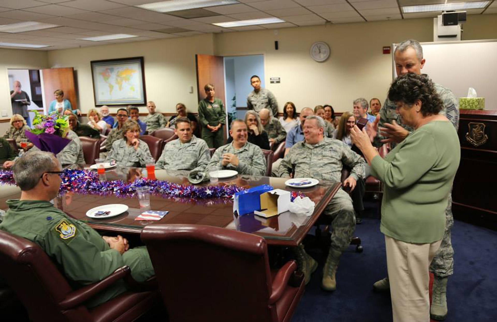 TRAVIS AIR FORCE BASE, Calif. -- Members of the 349th Air Mobility Wing bid farewell to Kathy Dalton, Reserve Personnel Appropriation budget analyst with the 349th AMW Finance Office, upon the occasion of her retirement from federal civil service, June 26, 2014, at Travis Air Force Base, Calif. (U.S. Air Force photo/Lt. Col. Robert Couse-Baker) 