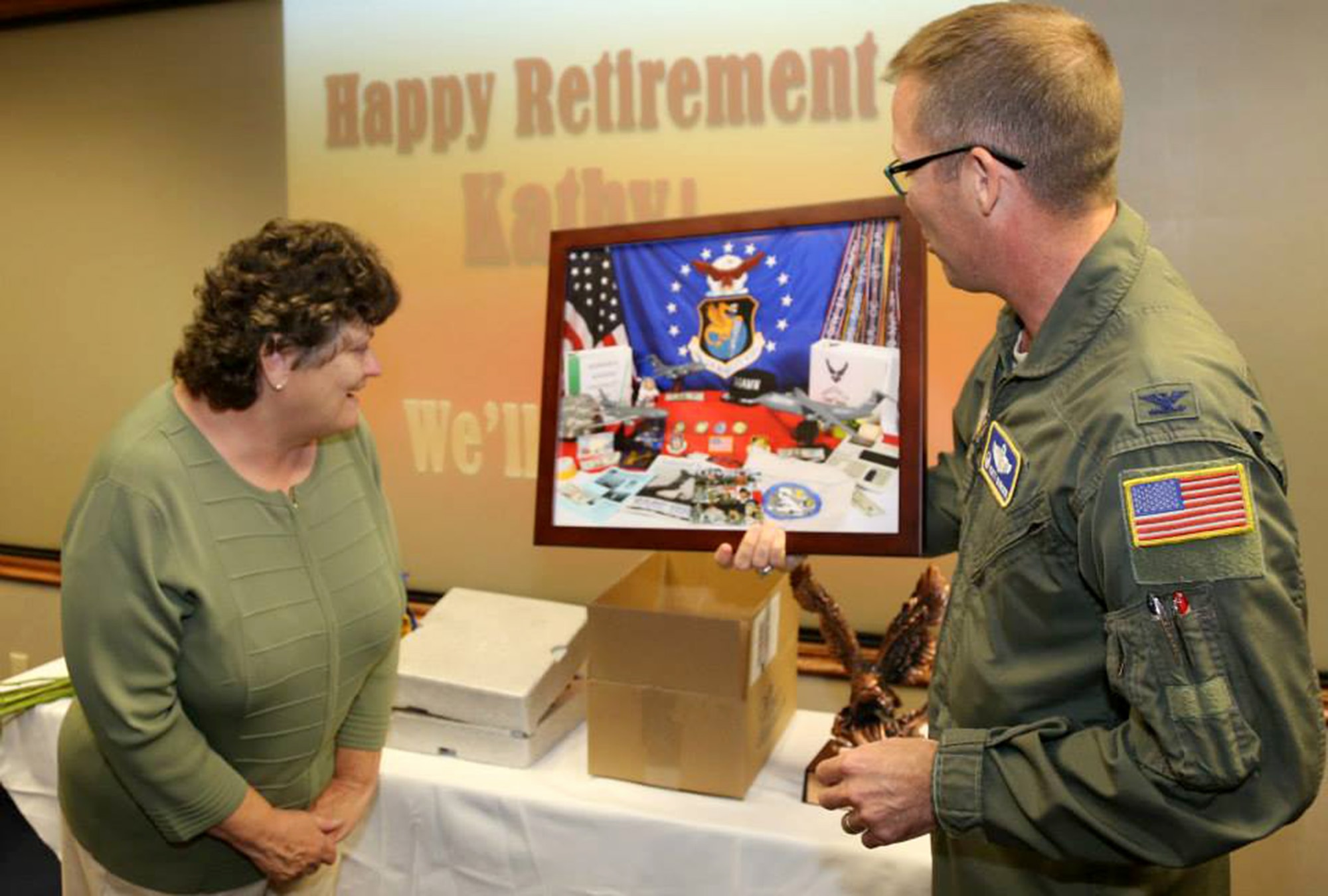 TRAVIS AIR FORCE BASE, Calif. -- Members of the 349th Air Mobility Wing bid farewell to Kathy Dalton, Reserve Personnel Appropriation budget analyst with the 349th AMW Finance Office, upon the occasion of her retirement from federal civil service, June 26, 2014, at Travis Air Force Base, Calif. (U.S. Air Force photo/Lt. Col. Robert Couse-Baker) 