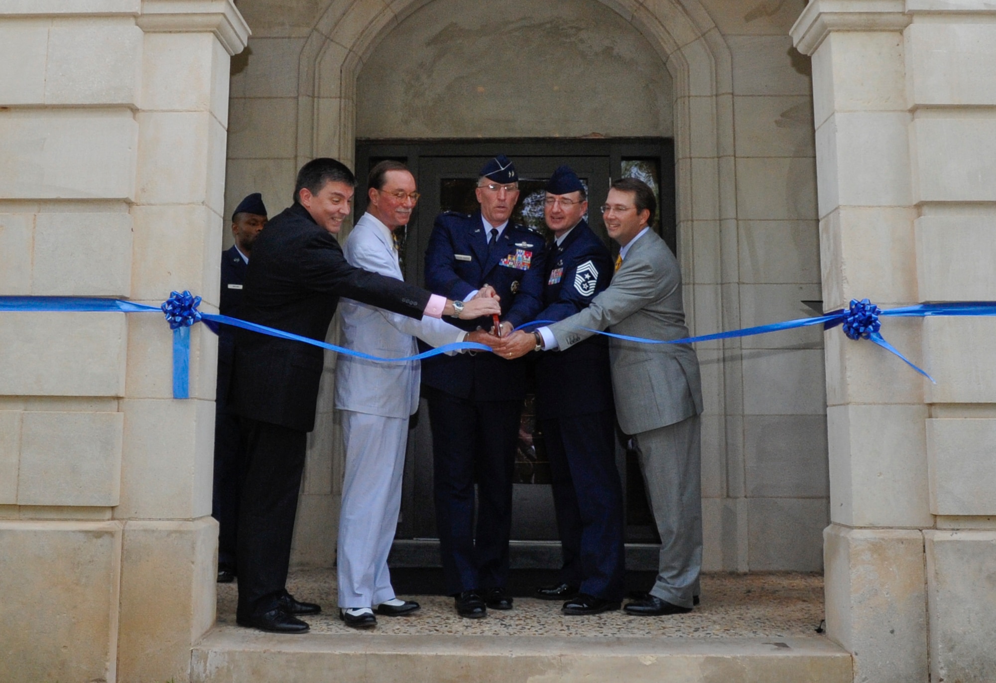 (Left to Right) Gary Hubbard, Murray Viser, Maj. Gen. Scott Vander Hamm, Eighth Air Force commander, Chief Master Sgt. Marty Anderson, Eighth AF command chief, and John Adkins cut a ribbon during the Eighth Air Force grand opening ceremony on Barksdale Air Force Base, La., July 2, 2014. The Eighth Air Force team consists of more than 16,000 active-duty, Air National Guard and Reserve professionals operating and maintaining a variety of aircraft capable of deploying air power to any area of the world. (U.S. Air Force photo/Senior Airman Kristin High)