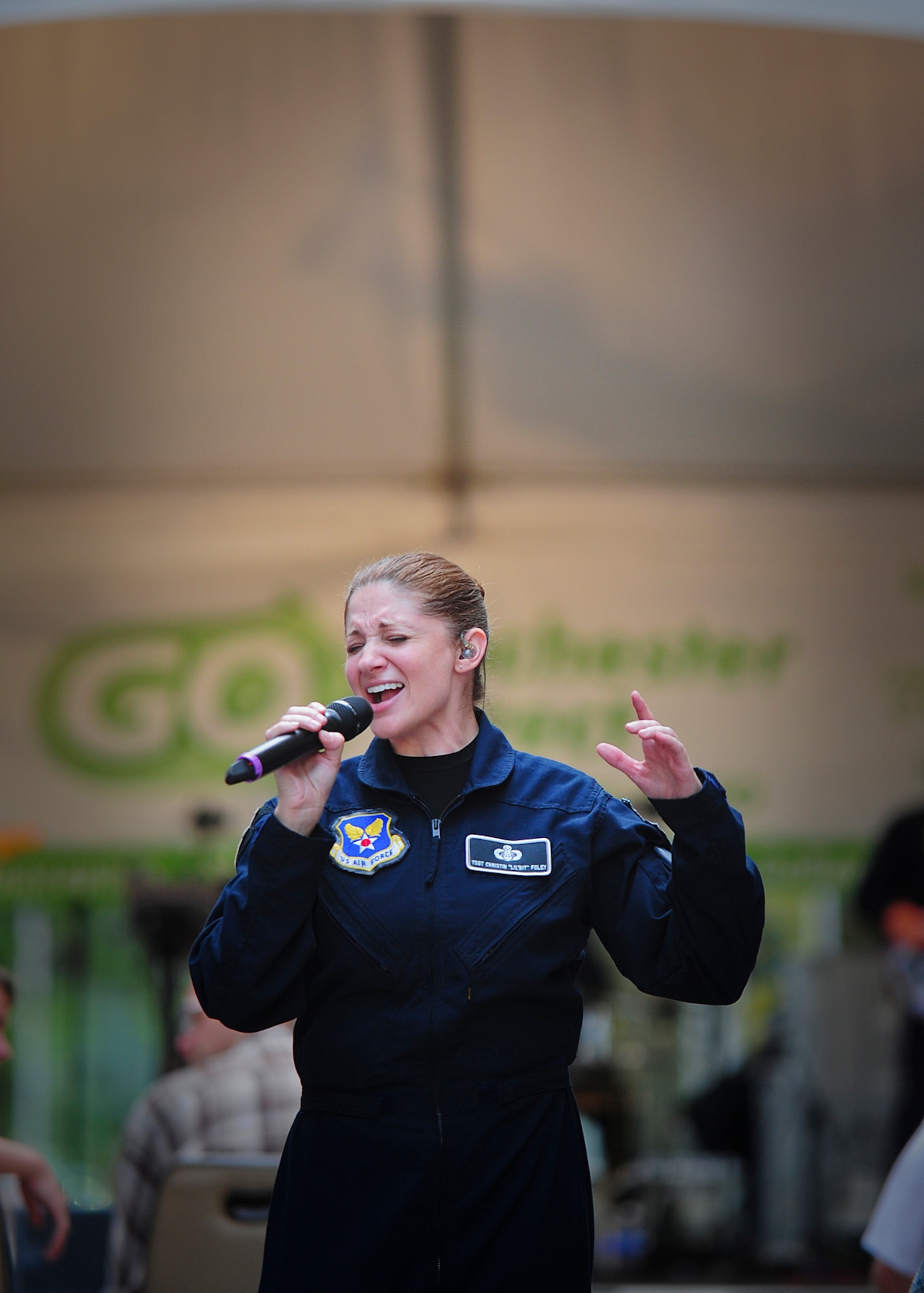 Tech. Sgt. Christin Foley, guest vocalist for the U.S. Air Force Band’s rock ensemble, Max Impact, performs at Peace Plaza in Rochester, Minnesota June 24, 2014. Max Impact recently completed a nine-day, seven-city, 10-performance tour across the Midwest with the U.S. Air Force Honor Guard Drill Team. During the tour, the two groups performed in Wisconsin, Minnesota, South Dakota, Wyoming and Nebraska. (U.S. Air Force Photo by 1st Lt. Nathan Wallin)