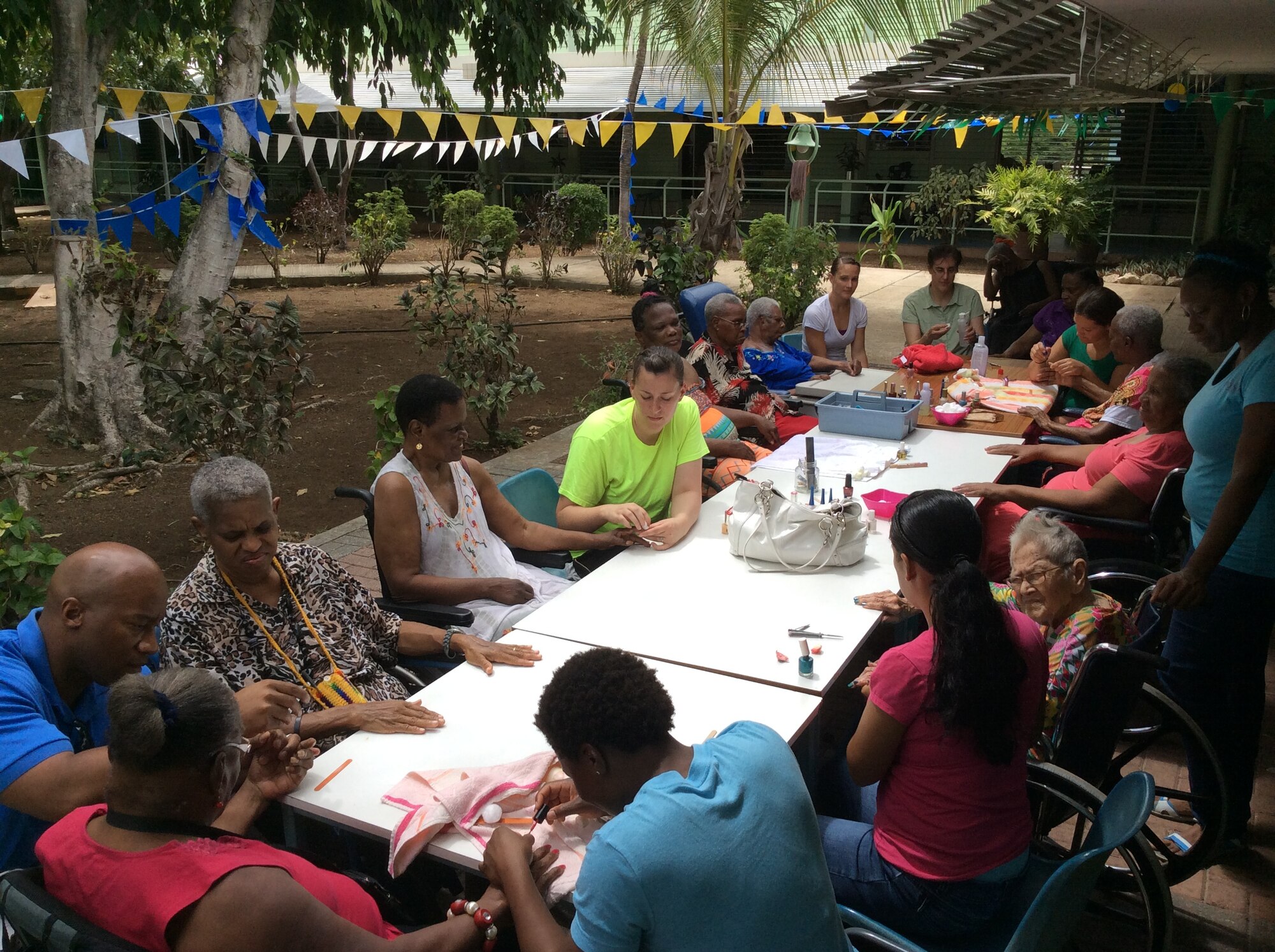 Six female volunteers from the U.S. Forward Operating Location spent several hours at Betesda Nursing Home in Betesda, Curacao, July 1, 2014. The volunteers offered the female residents a relaxing morning of manicures and spoke to the residents about life, family and culture, bringing the warmth of friendship directly to elders with one-on-one interaction. This informal volunteer partnership with Betesda helps emphasize a continuum of care for the Curacao senior community. Volunteers from the US FOL often donate time and resources to various areas and programs on the island, in order to express appreciation for the wonderful hospitality received from the citizens of Curacao. (Courtesy Photo) 