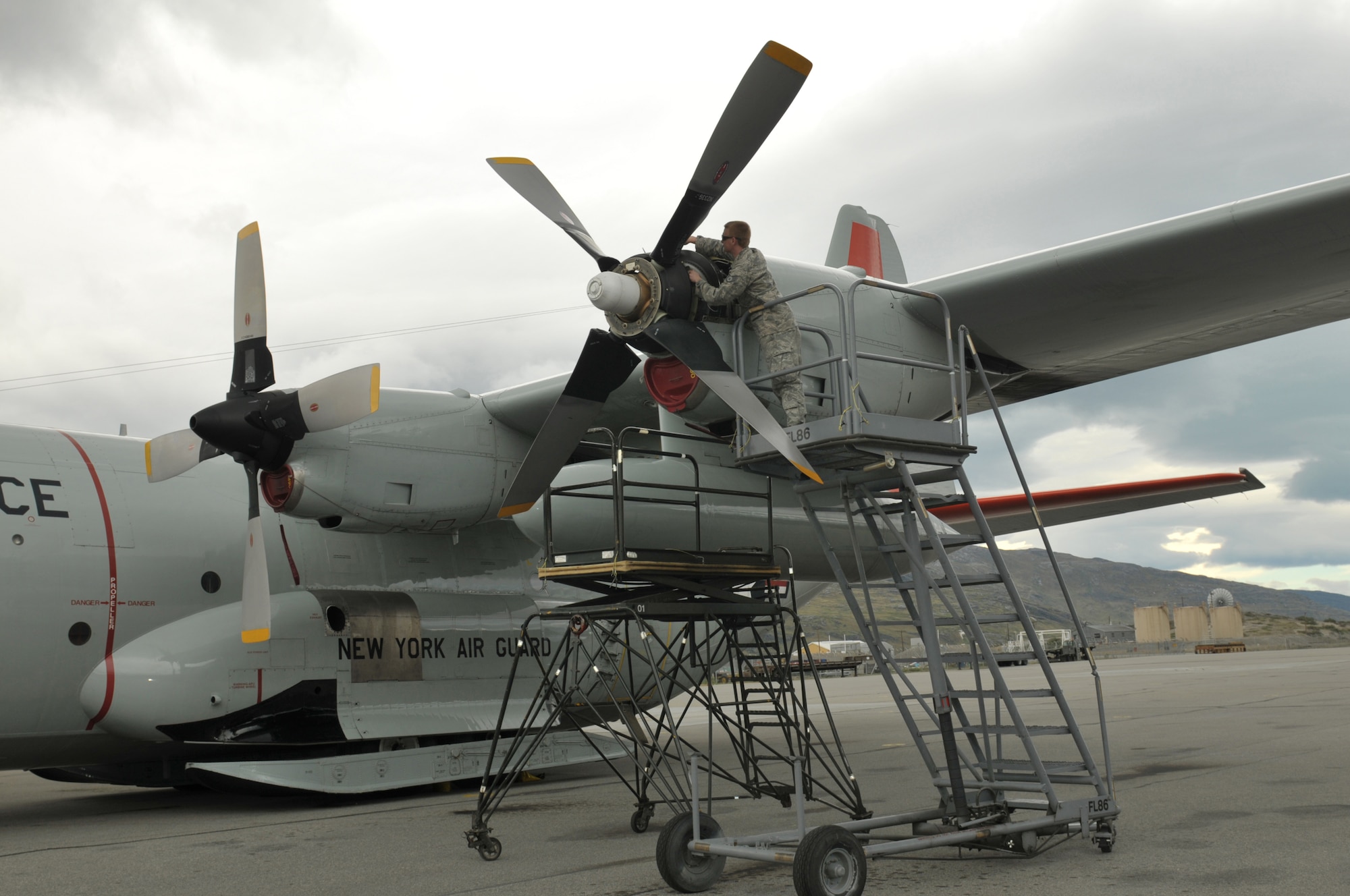 Staff Sgt. Christopher Smith, 109th Maintenance Group, works on a propeller of an LC-130 "Skibird" at Kangerlussuaq, Greenland, on June 29, 2014. Two LC-130s and 70 Airmen from the 109th Airlift Wing out of Stratton Air National Guard Base, Scotia, N.Y., recently completed the fourth rotation of the 2014 Greenland season. The unit flies supply and refueling missions to various camps in support of the National Science Foundation and also trains for the Operation Deep Freeze mission in Antarctica. (U.S. Air National Guard photo by Master Sgt. William Gizara)

