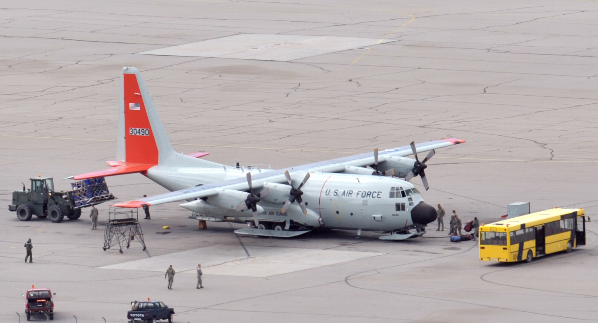 Airmen with the 109th Small Air Terminal unload cargo from an LC-130 "Skibird" with the 109th Airlift Wing from Stratton Air National Guard Base, Scotia, N.Y., on the flightline at Kangerlussuaq, Greenland, on June 29, 2014, after returning from a mission at Summit Camp. Two LC-130s and 70 Airmen from the Wing recently completed the fourth rotation of the 2014 Greenland season. The unit flies supply and refueling missions to various camps in support of the National Science Foundation and also trains for the Operation Deep Freeze mission in Antarctica. (U.S. Air National Guard photo by Staff Sgt. Benjamin German)