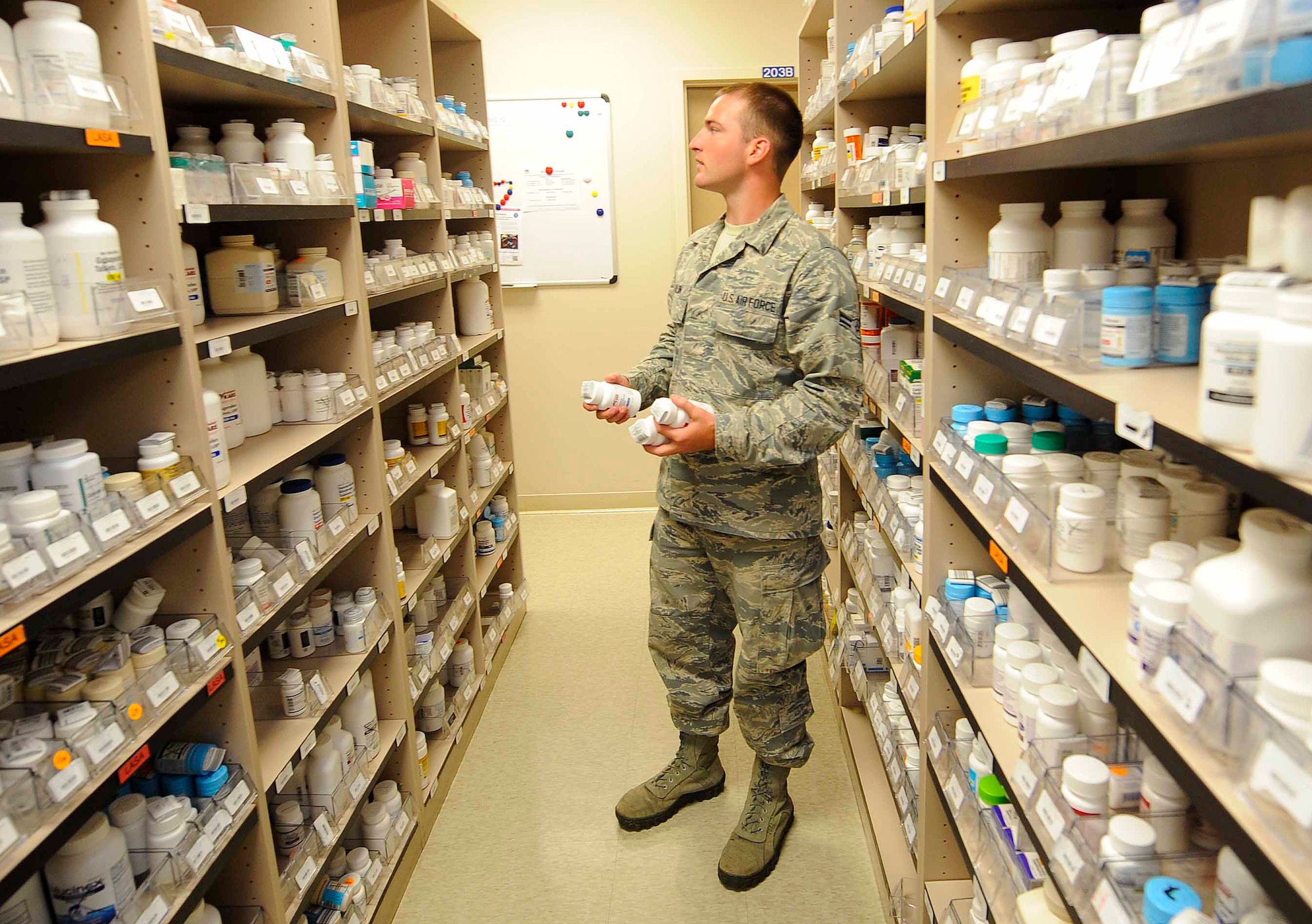 Airman 1st Class Christopher Mauldin, 1st Special Operations Medical Operations Squadron medical logistics technician, stores medication at Hurlburt Field, Fla., May 30, 2014. Medication is alphabetically stored on selves until a prescription needs to be filled. (U.S. Air Force photo/Airman 1st Class Andrea Posey)