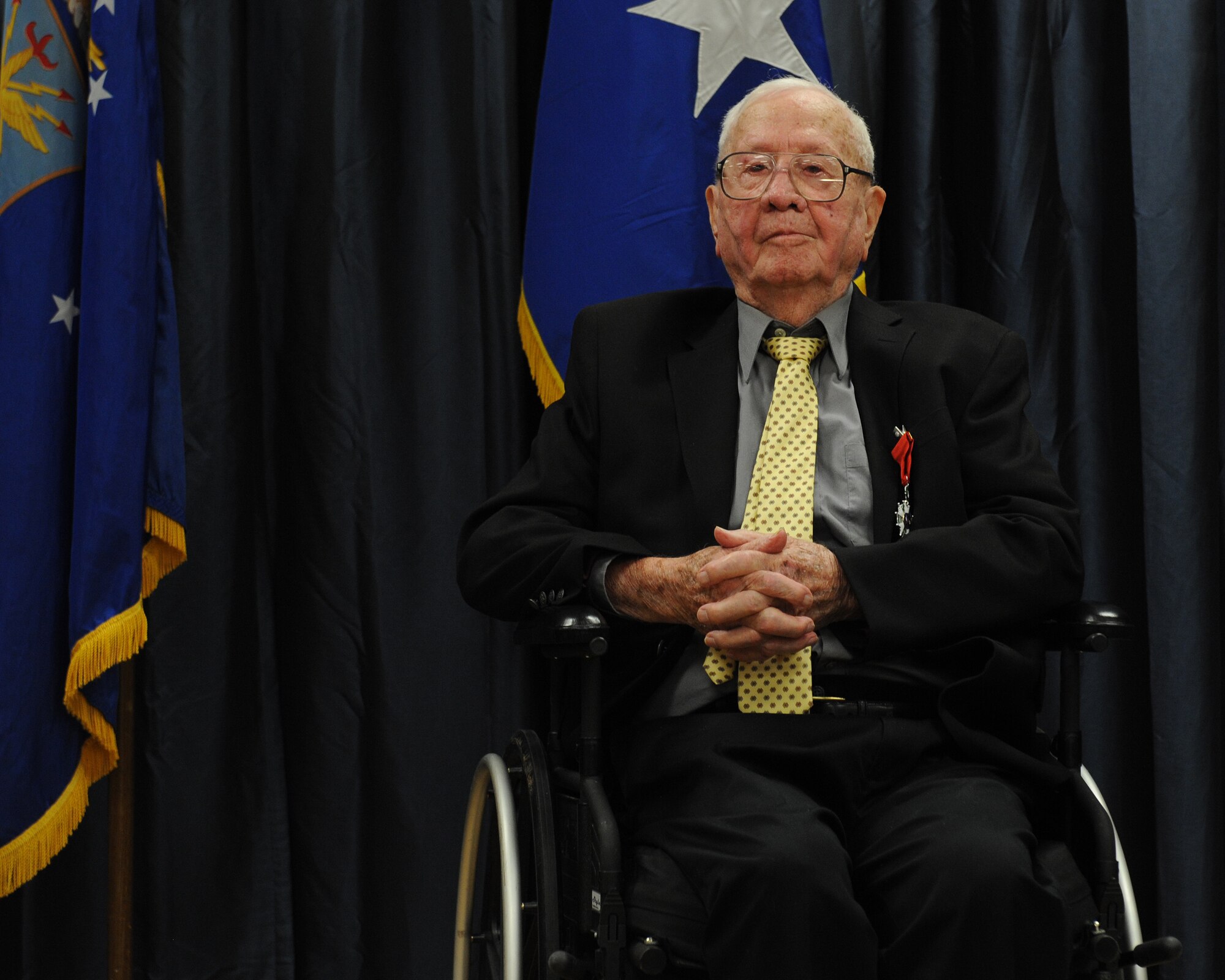 John Carpenter, a World War II veteran, was presented the French Legion of Honor for his service during World War II on Barksdale Air Force Base, La., July 1, 2014. As a logistics soldier during World War II, Carpenter received recognition from General George Patton for his contributions to the war effort. Carpenter received the Bronze Star, which was an uncommon award given to logistics soldiers. (U.S. Air Force photo/Senior Airman Benjamin Gonsier)
