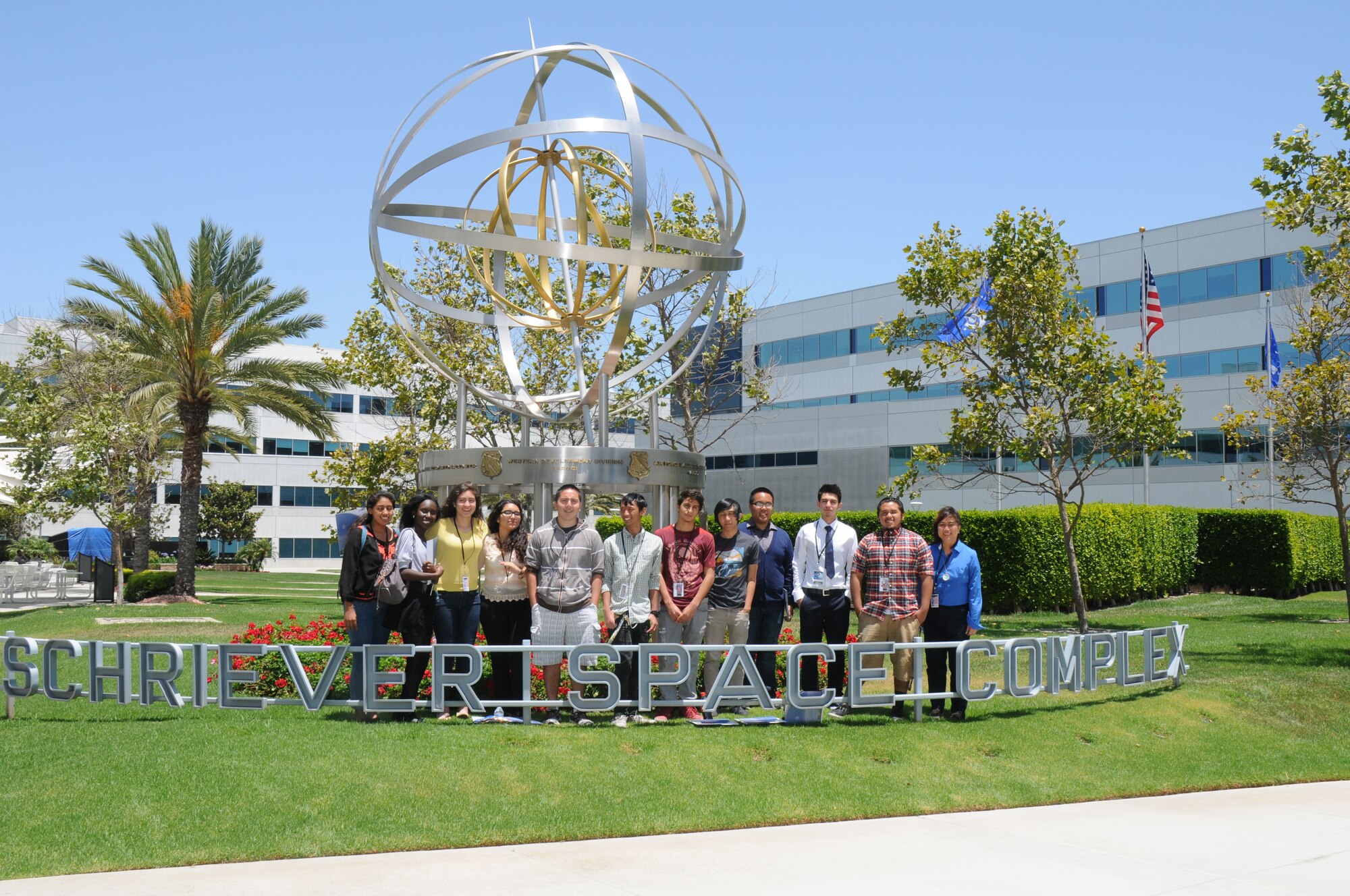 Students from five local area high schools teamed up with Space and Missile Systems Center mentors atop of the Los Angeles AFB, 7th floor parking lot, where they launched payloads and recorded flight data and or went back to the drawing board to make improvements, Jun 16, 2014. The STEM event is part of the SMC 60th Anniversary as the six teams were responsible for “fundamental design practices to... develop imaging and data acquisition payloads to be launched from the roof of the parking garage. Students were responsible for designing, building, integrating and testing electronics packages into a bus structure capable of surviving launch, flight and recovery. A small parachute will be deployed from each payload to increase time aloft to gather data. Data and imagery will be acquired and judges will evaluate the payloads on functionality, structural integrity and aesthetics”. (Photo by Joe Juarez)