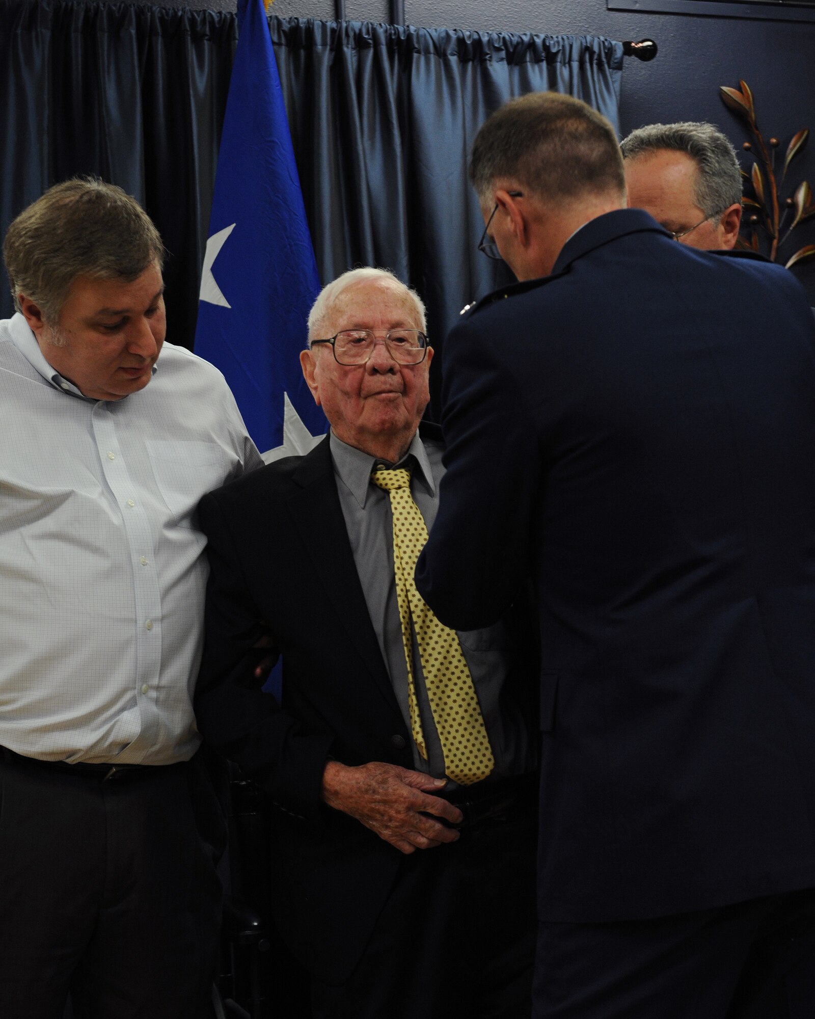 John Carpenter, a World War II veteran, receives the French Legion of Honor from Maj. Gen. Scott Vander Hamm, 8th Air Force commander, on Barksdale Air Force Base, La., July 1, 2014. More than 70 years after the Invasion of Normandy, John Carpenter, a local veteran who participated in the Invasion of Normandy and Battle of the Bulge received the French Legion of Honor. (U.S. Air Force photo/Senior Airman Benjamin Gonsier)