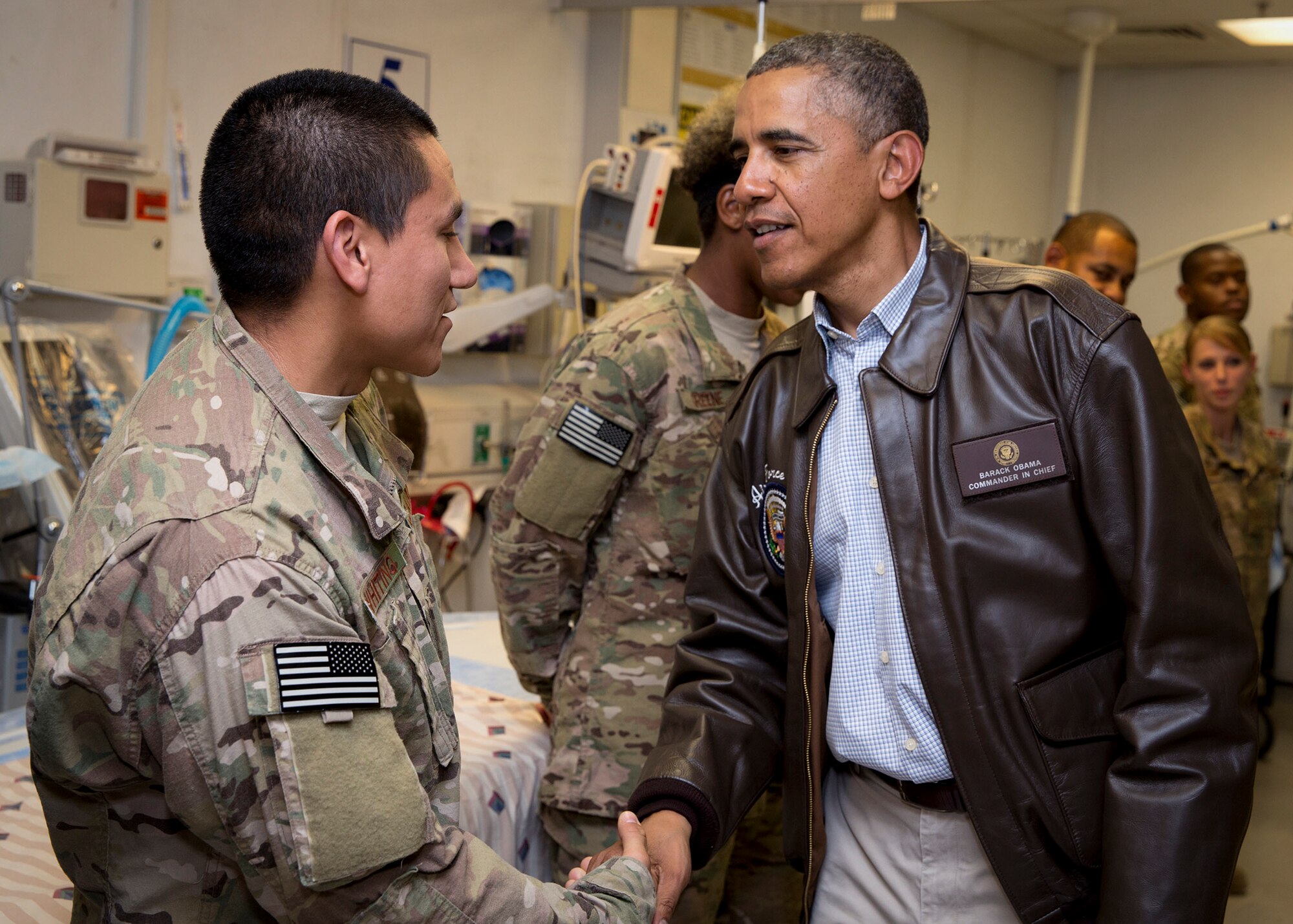 President Barack Obama meets with deployed 96th Medical Group Airman, Staff Sgt. David Whiting, at the Craig Joint Theater Hospital at Bagram Airfield in Bagram, Afghanistan, May 25, 2014.  The President met with Whiting and other medics recognized for outstanding duty during the visit.  Whiting is a member of the diagnostic imaging team in the Expeditionary Medical Support Squadron.  (Official White House Photo/Pete Souza)