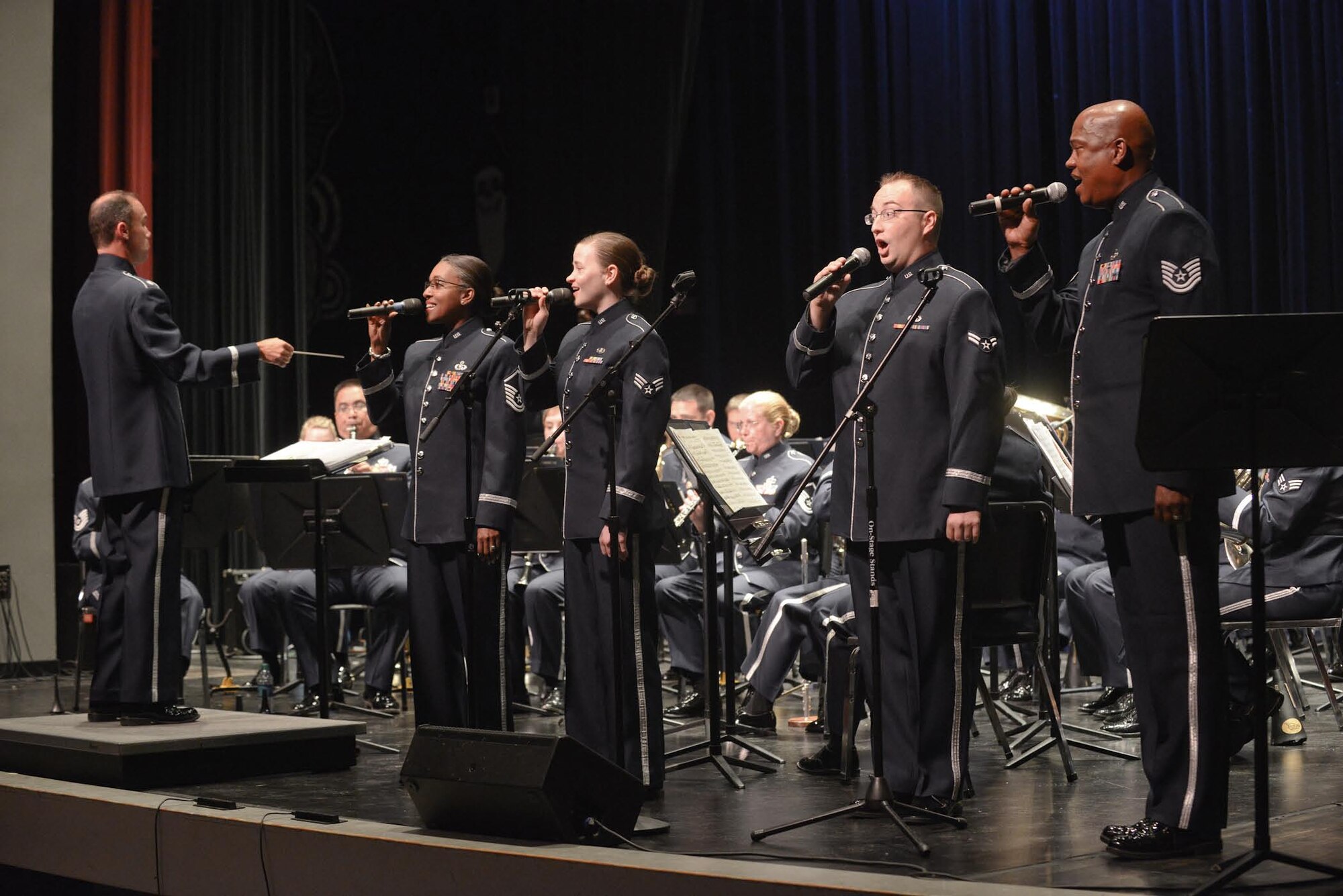Members of the  531st Air Force Band, Band of the Southwest, Air National Guard, sing patriotic songs to the local community audiences at Bossier Parish Community College, Bossier City, Louisiana, June 25, 2014. The band's summer tour includes nine venues spread out between locations in Arkansas and Louisiana. (Air National Guard photo by Master Sgt. Charles Hatton/Released)