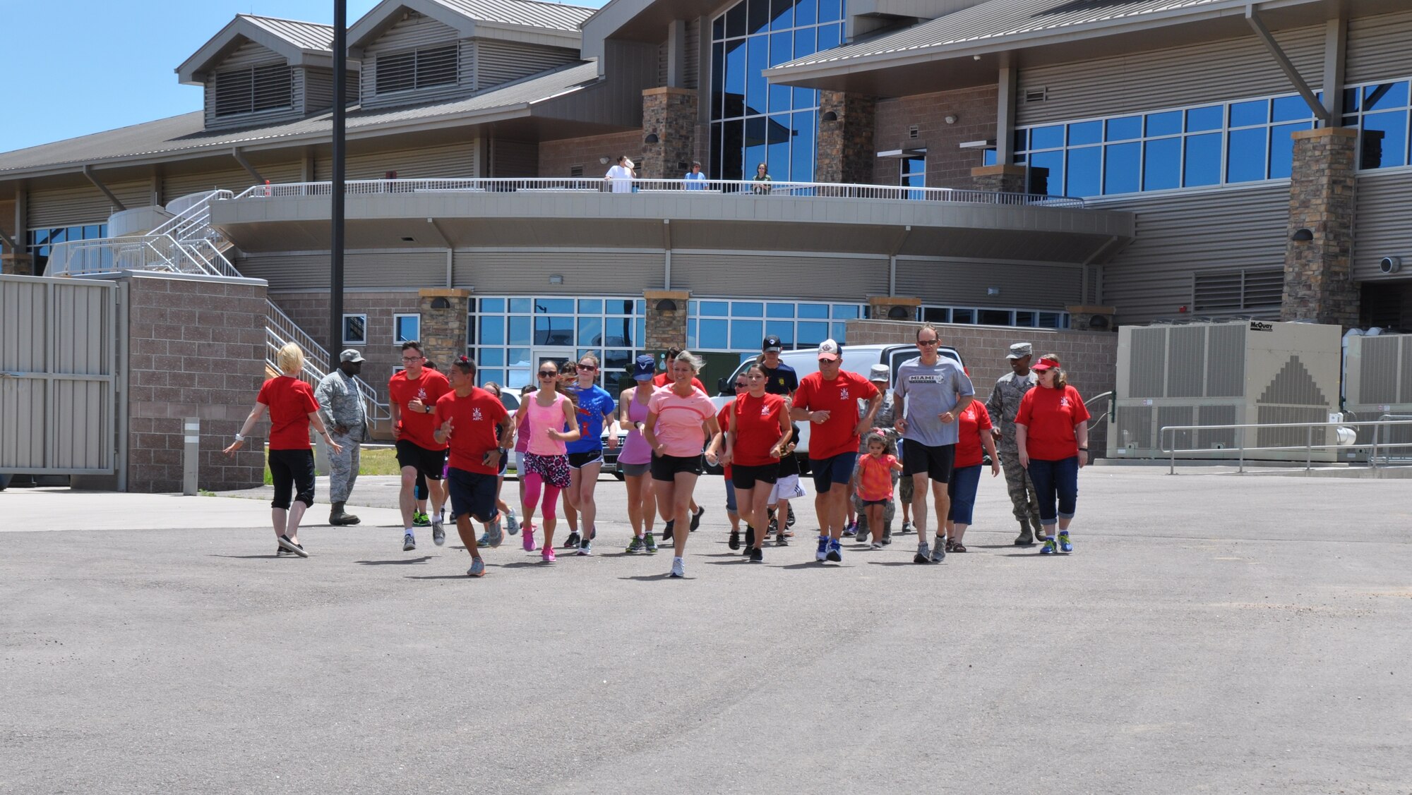 Runners begin the 3-kilometer run held during the Air Reserve Personnel Center 's commander's fitness and funfest June 30 at Buckley Air Force Base, Colo., June 30, 2014. More than 150 service members, civilians and their families attended the event sponsored by the ARPC Booster Club, Junior Enlisted Advisory Council and Top 3. The fitness funfest highlighted the commander’s physical fitness enhancement program’s winning team for the April through June quarter and served as this year's picnic. (U.S. Air Force photo/Tech. Sgt. Rob Hazelett)