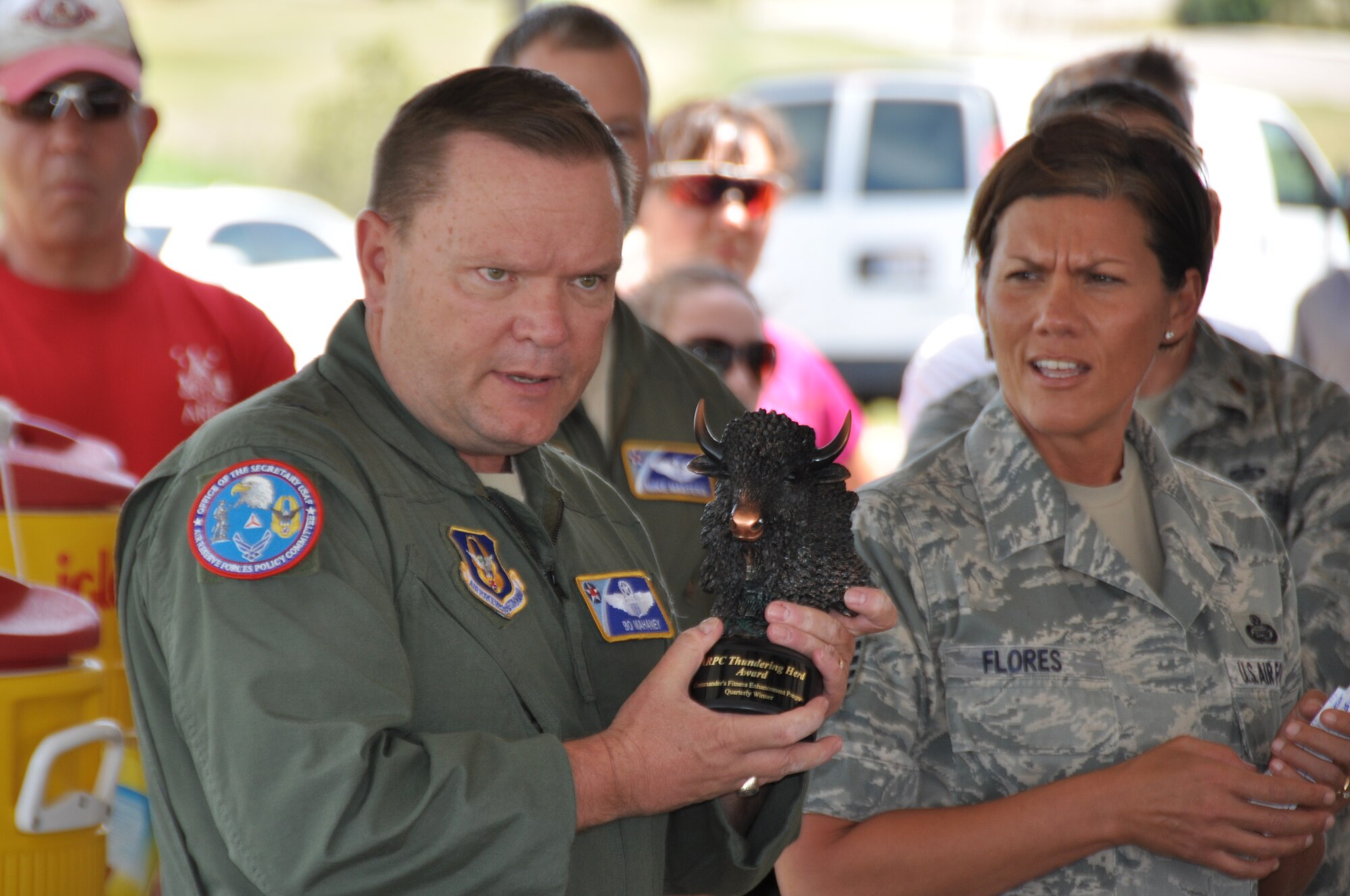 Brig. Gen. Samuel “Bo” Mahaney, Air Reserve Personnel Center commander, and Chief Master Sgt. Ruthe Flores, ARPC command chief, speak to more than 150 service members, civilians and their families during the ARPC commander's fitness and funfest June 30, 2014, at Buckley Air Force Base, Colo. (U.S. Air Force photo/Tech. Sgt. Rob Hazelett)