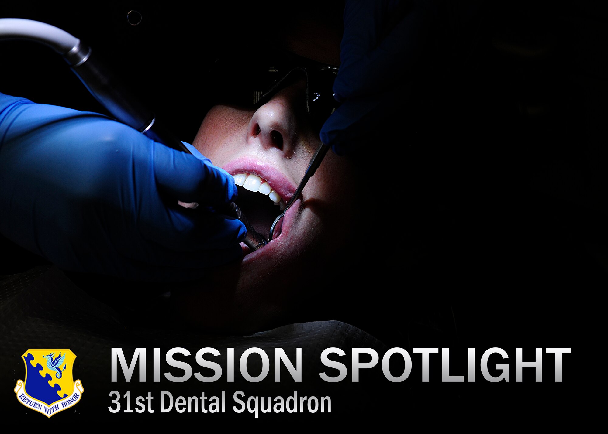 Senior Airman Patricia Gregg, 724th Air Mobility Squadron, receives a routine cleaning during an annual checkup, June 19, 2014, at Aviano Air Base, Italy.  The 31st Dental Squadron’s clinical flight is highly visible and deals with treating patients and providing direct care through the dental clinic and surgeries. (U.S. Air Force photo/Airman 1st Class Ryan Conroy)