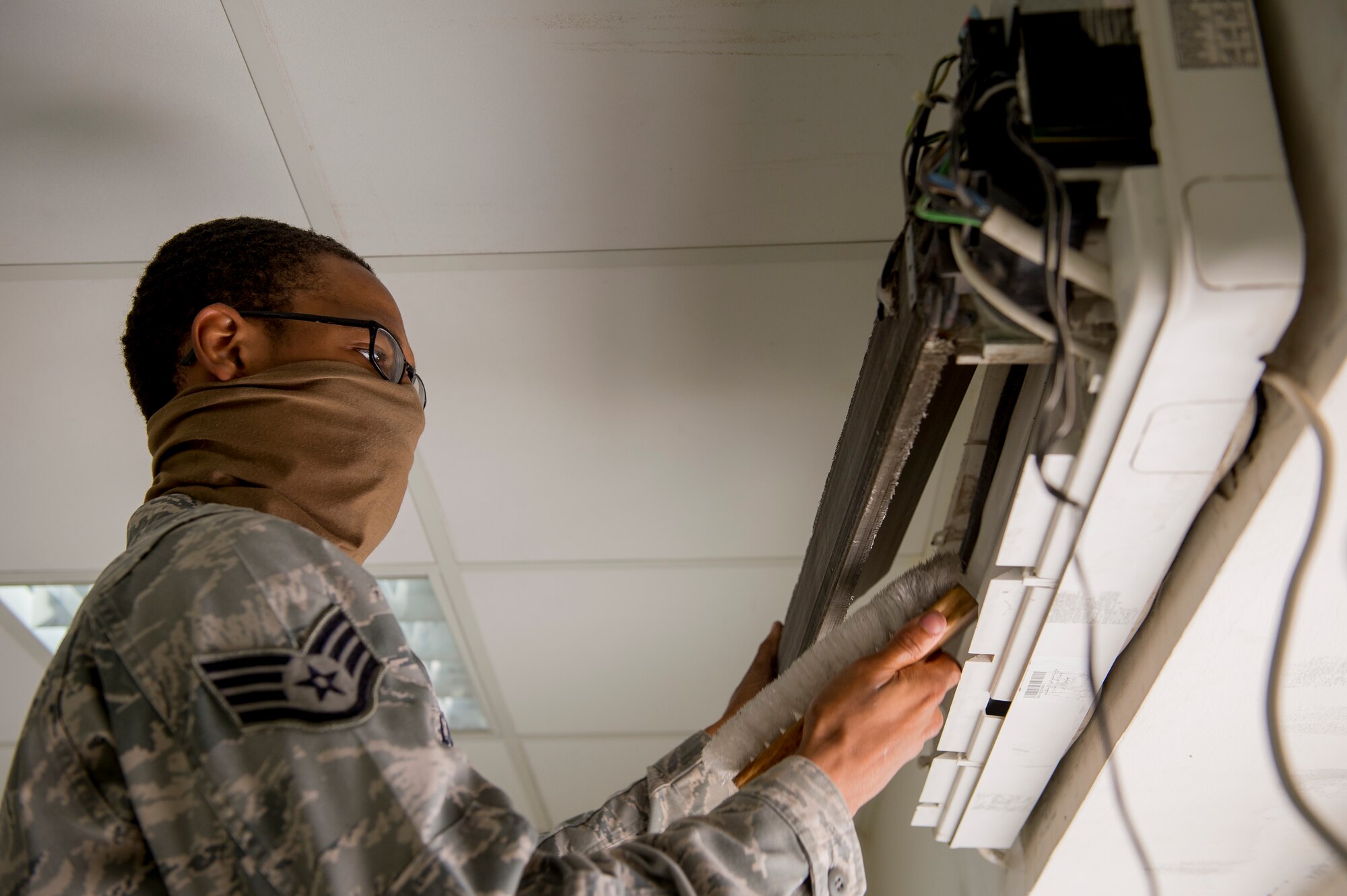 U.S Air Force Staff Sgt. Roger Lord, 386th Expeditionary Civil Engineer Squadron heating, ventilation, and air condition technician, cleans an air conditioning unit as part of a base dormitory renovation June 10, 2014 at an undisclosed location in Southwest Asia. Lord is deployed from the 137th Civil Engineer Squadron, Will Rogers Air National Guard Base, Oklahoma in support of Operation Enduring Freedom. A total of 23 dorms are scheduled to be renovated by the end of the year. (U.S. Air Force photo by Staff Sgt. Jeremy Bowcock)