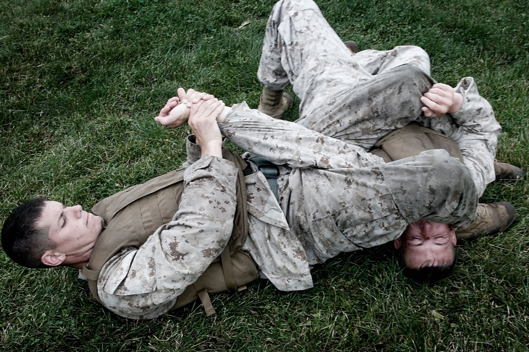 U.S. Marine Corps Cpl. Adam Gerber, a martial arts instructor trainee from Detachment 1, Communication Company, Combat Logistics Regiment 45, 4th Marine Logistics Group, puts pressure on a combatant's arm during a martial arts instructor training class held at Grissom Air Reserve Base, Ind., June 20, 2014. Grissom Marines went through 13 vigorous days of training to become martial arts instructors so they can help fellow Marines improve their combat skills. (U.S. Air Force photo/Tech. Sgt. Douglas Hays)