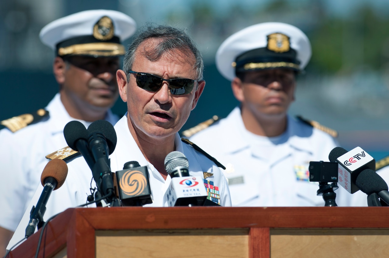 Navy Adm. Harry B. Harris Jr., commander of U.S. Pacific Fleet, answers questions about the 2014 Rim of the Pacific international maritime exercise during a news conference on Joint Base Pearl Harbor-Hickam, Hawaii, June 30, 2014. Twenty-two nations, more than 40 ships and submarines, more than 200 aircraft and 25,000 personnel are participating in the exercise. U.S. Air Force photo by Staff Sgt. Christopher Hubenthal
