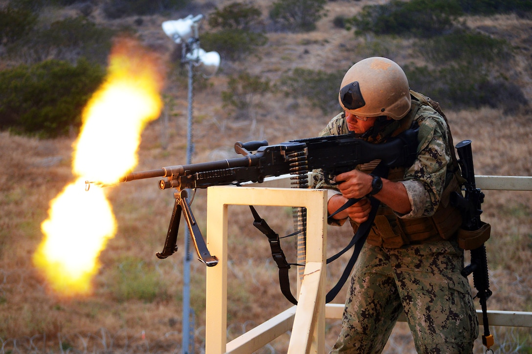 A sailor fires an M240B machine gun during training and readiness assessment in preparation for deployment on Camp Pendleton, Calif., June 20, 2013. The sailor is assigned to Coastal Riverine Squadron 3. 