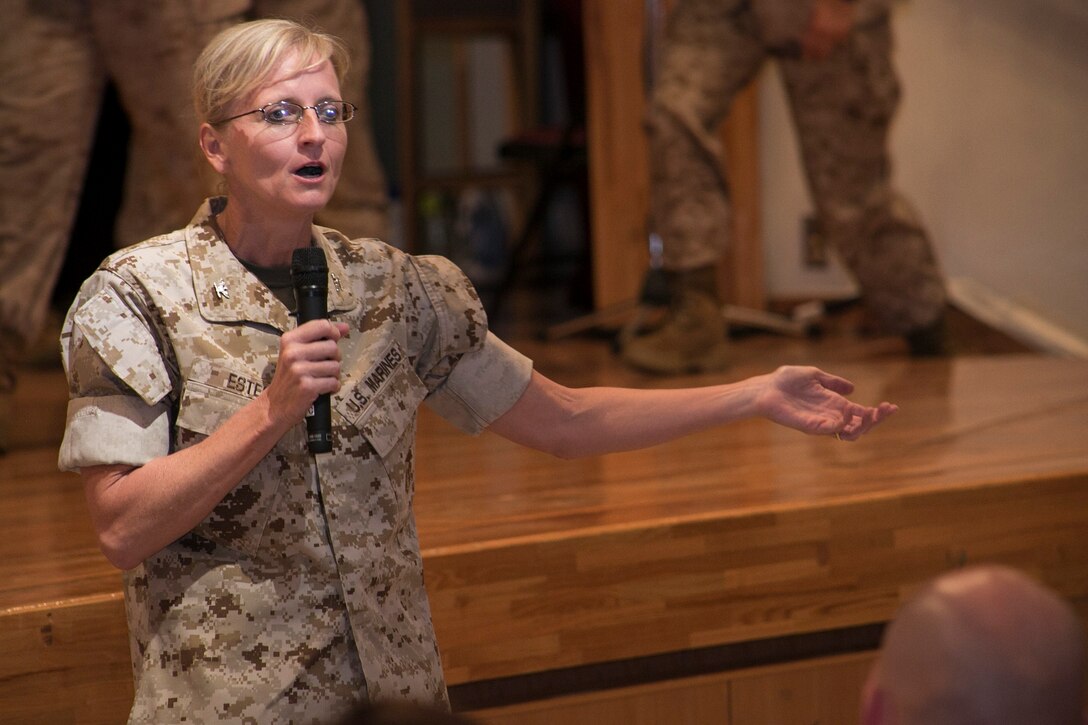 Col. Katherine J. Estes, a Marceline, Missouri, native, offers words of encouragement and gratitude June 30 at the Camp Foster Community Center during a ceremony marking the end of her two-year term as commanding officer of Headquarters and Support Battalion. Col. Thomas A. Pecina, a Lubbock, Texas, native, assumed command of the battalion. The battalion is part of Marine Corps Installations Pacific-Marine Corps Base Camp Butler. 