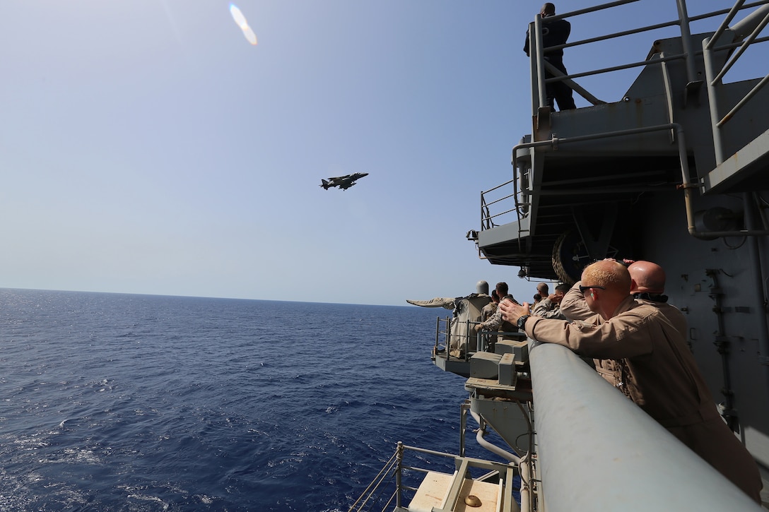 A U.S. Marine Corps AV-8B Harrier aircraft with Marine Medium Tiltrotor Squadron (VMM) 263 (Reinforced), 22nd Marine Expeditionary Unit (MEU), prepares to land aboard the USS Bataan (LHD 5), at sea, after a Tactical Air Control Party exercise June 20, 2014. Elements of the 22nd MEU, embarked aboard Bataan, are operating in the U.S. 6th Fleet area of operations to augment U.S. Crisis Response forces in the region. (U.S. Marine Corps photo by Gunnery Sgt. Freddy G. Cantu/Released)