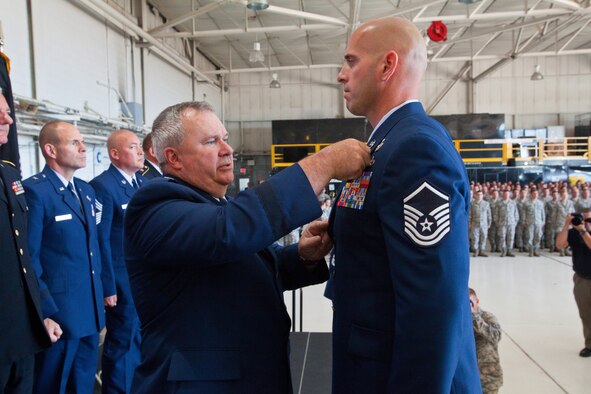 Brig. Gen. Michael L. Cunniff, left, The Adjutant General of New Jersey, presents Master Sgt. Michael F. Sears, 177th Fighter Wing, the Silver Star, the third highest military award, June 28, 2014, during a ceremony at the 177th at Egg Harbor Township, N.J., for actions while deployed to Afghanistan on Sept. 29, 2012.  (U.S. Air National Guard photo by Master Sgt. Mark C. Olsen)