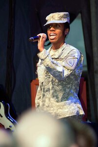 Indiana Army National Guard Staff Sgt. Betty White sings the national anthem, Feb. 2, 2012, at a celebration leading up to Super Bowl 46.