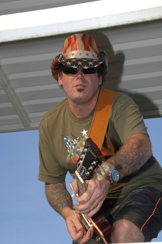 Nikk Nicholson, guitarist with Barb Wired, jams to a mixture of rock and blues during Marine Corps Logistics Base Albany’s annual Independence Day celebration, June 27.