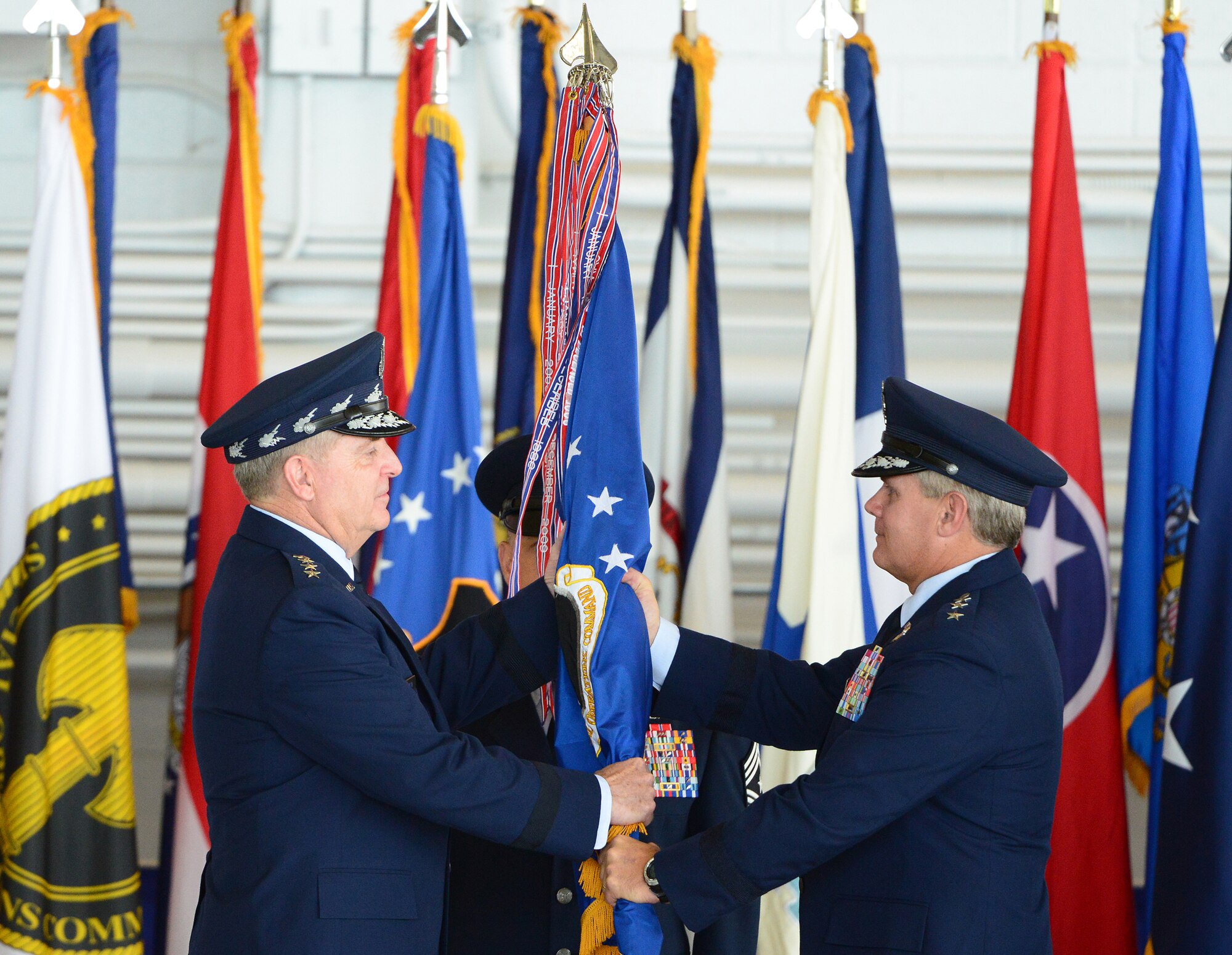 Lt. Gen. Eric E. Fiel relinquishes command of Air Force Special Operations Command to Air Force Chief of Staff Gen. Mark A. Welsh III during a change of command ceremony held at Hurlburt Field, Fla., July 3, 2014.  The command's mission is to present combat-ready Air Force Special Operations Forces to conduct and support global special operations missions. (U.S. Air Force photo by Master Sgt. Steven Pearsall)