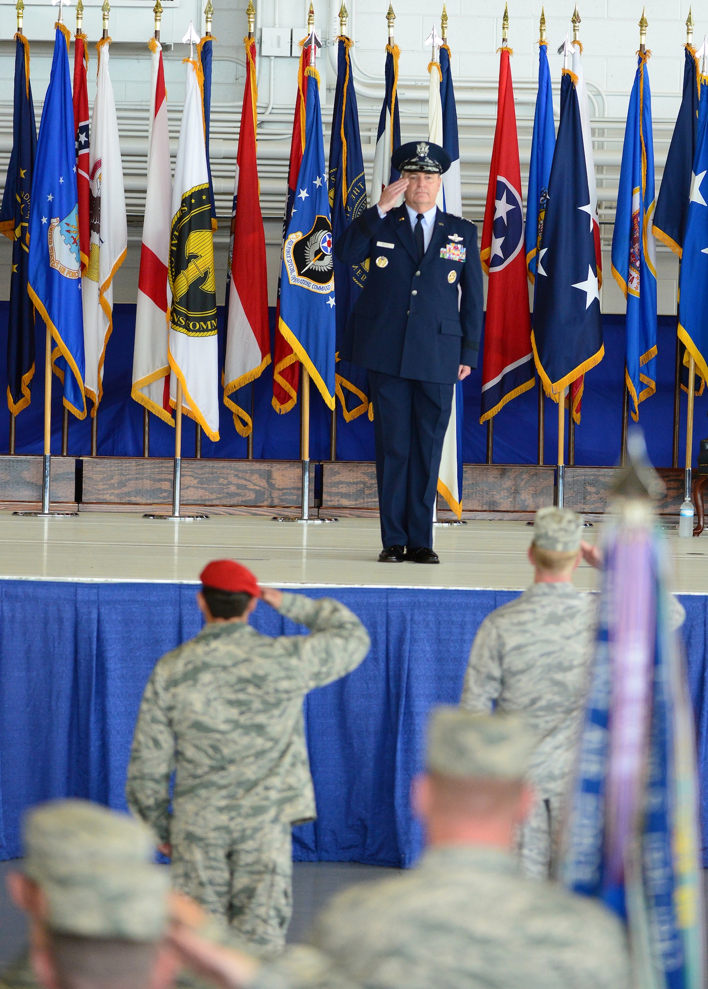 Air Force Chief of Staff Gen. Mark A. Welsh III is presented the command during the Air Force Special Operations Command change of command ceremony held at Hurlburt Field, Fla., July 3, 2014.  The command's mission is to present combat-ready Air Force Special Operations Forces to conduct and support global special operations missions. (U.S. Air Force photo by Master Sgt. Steven Pearsall)