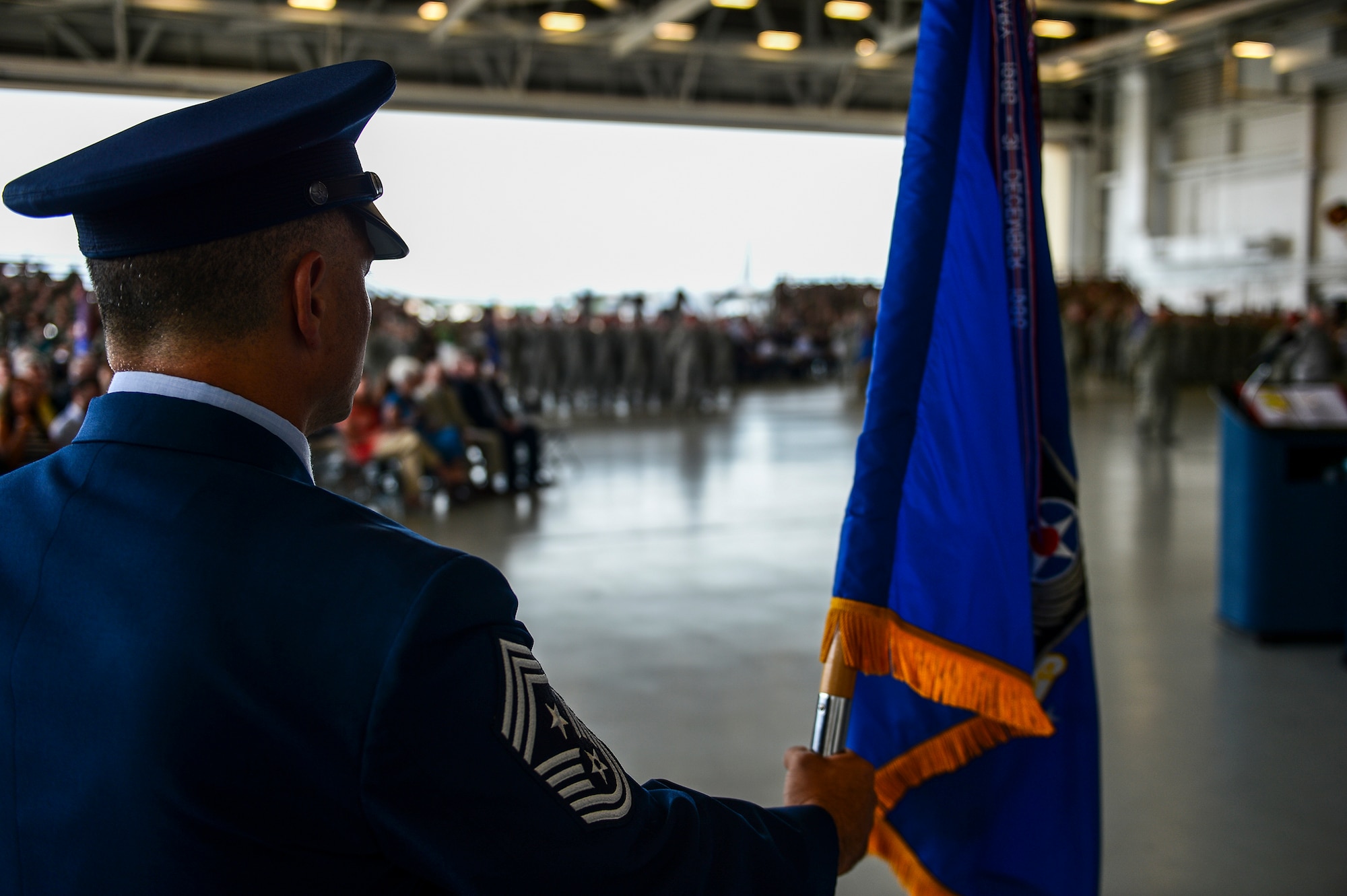 Chief Master Sgt. Matthew Caruso, Air Force Special Operations Command command chief, holds the command flag during the AFSOC change of command ceremony at Hurlburt Field, Fla., July 3, 2014. The command's mission is to present combat-ready Air Force Special Operations Forces to conduct and support global special operations missions. (U.S. Air Force photo by Airman 1st Class Jeff Parkinson)