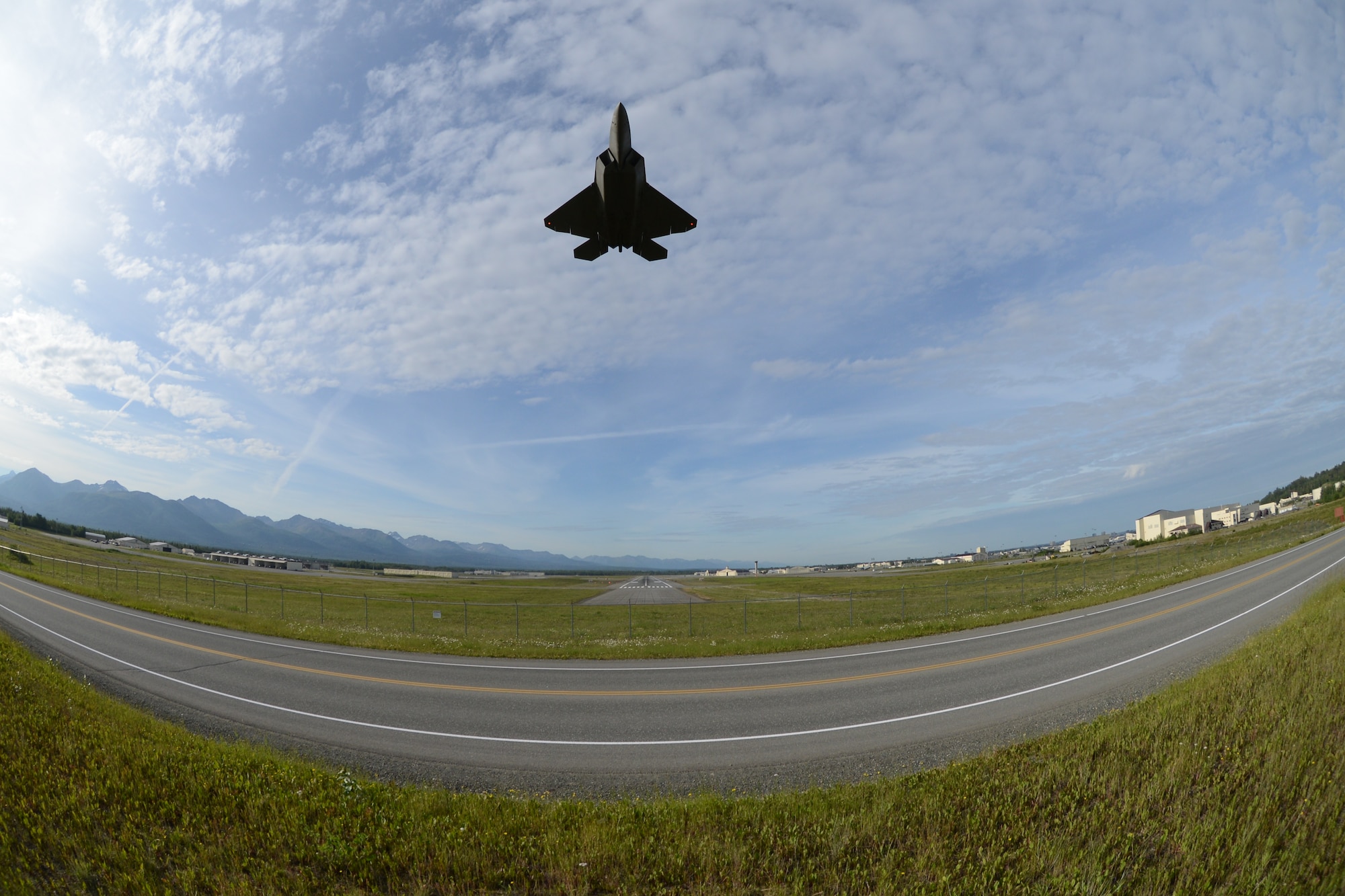 Maj. Jonathan Gration, Reserve F-22 pilot assigned to the 302nd Fighter Squadron, takes off from Joint Base Elmendorf-Richardson July 3. This flight marked Gration’s 1,000 flight hour in the F-22 making him only the fourth Air Force pilot to reach this milestone. (U.S. Air Force photo/Tech. Sgt. Dana Rosso)