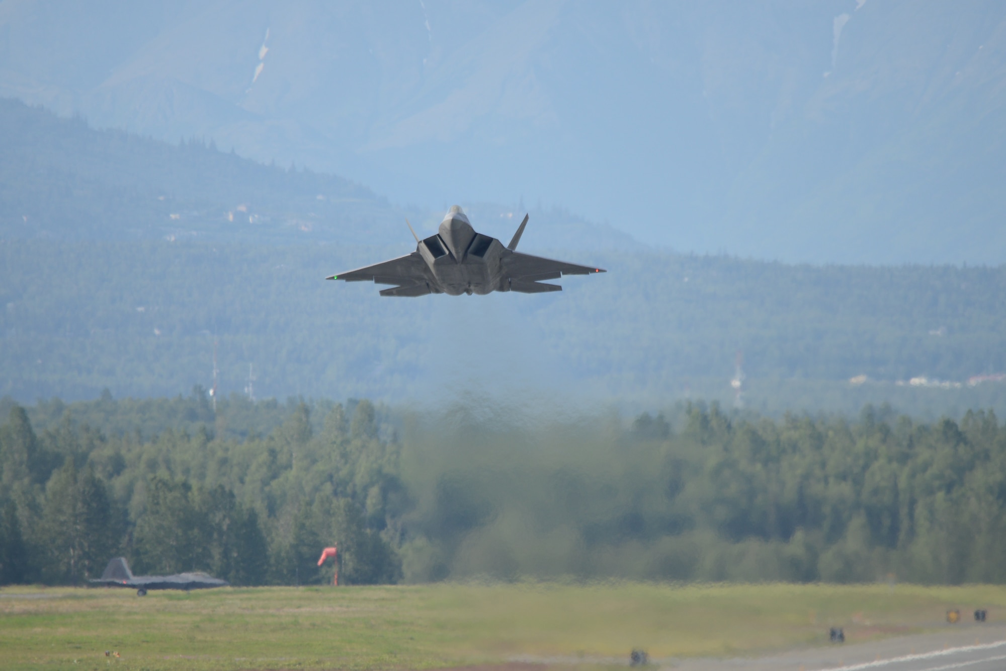 Maj. Jonathan Gration, Reserve F-22 pilot assigned to the 302nd Fighter Squadron, takes off from Joint Base Elmendorf-Richardson July 3. This flight marked Gration’s 1,000 flight hour in the F-22 making him only the fourth Air Force pilot to reach this milestone. (U.S. Air Force photo/Tech. Sgt. Dana Rosso)