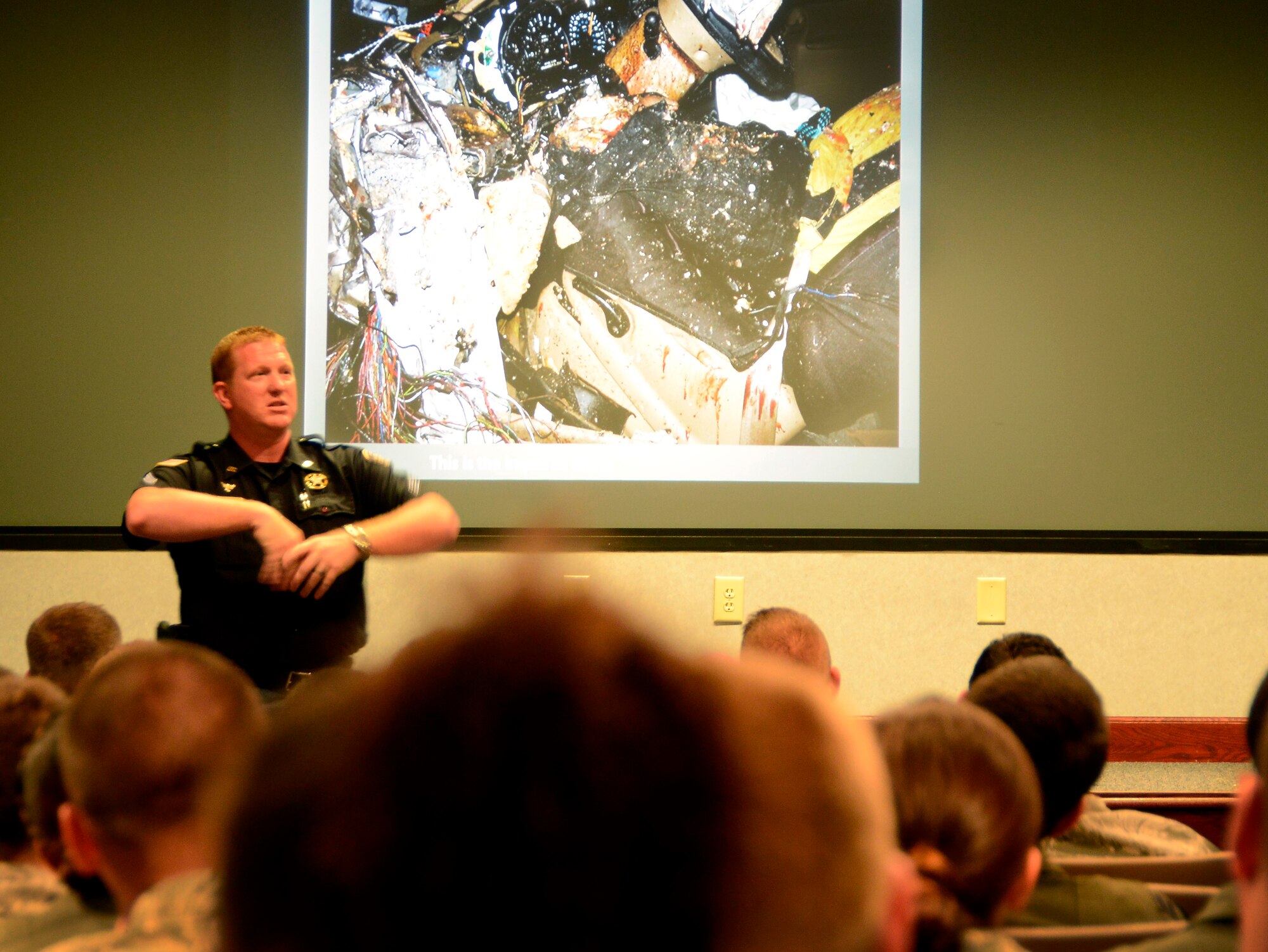 Cpl. Justin Hall, a crash investigator with Houston County Sheriff’s Office, talks to Airmen at an All Call July 2. Stories, statistics, education and awareness about alcohol consumption were part of briefing. According to Hall, it’s an individual decision whether or not to drink and drive, and it’s a voluntary one at that. He said everyone always wants to be given a number on how many drinks are too many in order to drive. “The number is zero,” he said. (U.S. Air Force photo by Ed Aspera)
