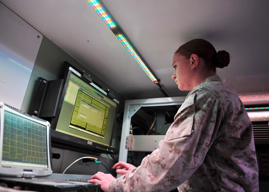 U.S. Marine Corps Lance Cpl. Abby Brooks, Marine Air Control Squadron 2 aviation communication system technician assigned to Marine Corps Air Station Cherry Point, N.C., checks different radio communications during Red Flag-Alaska 14-2 June 24, 2014, Joint Pacific Alaska Range Complex, Alaska. During operations, Brooks is able to listen to different radios to troubleshoot them if any communication is altered. (U.S. Air Force photo by Senior Airman Ashley Nicole Taylor/Released)