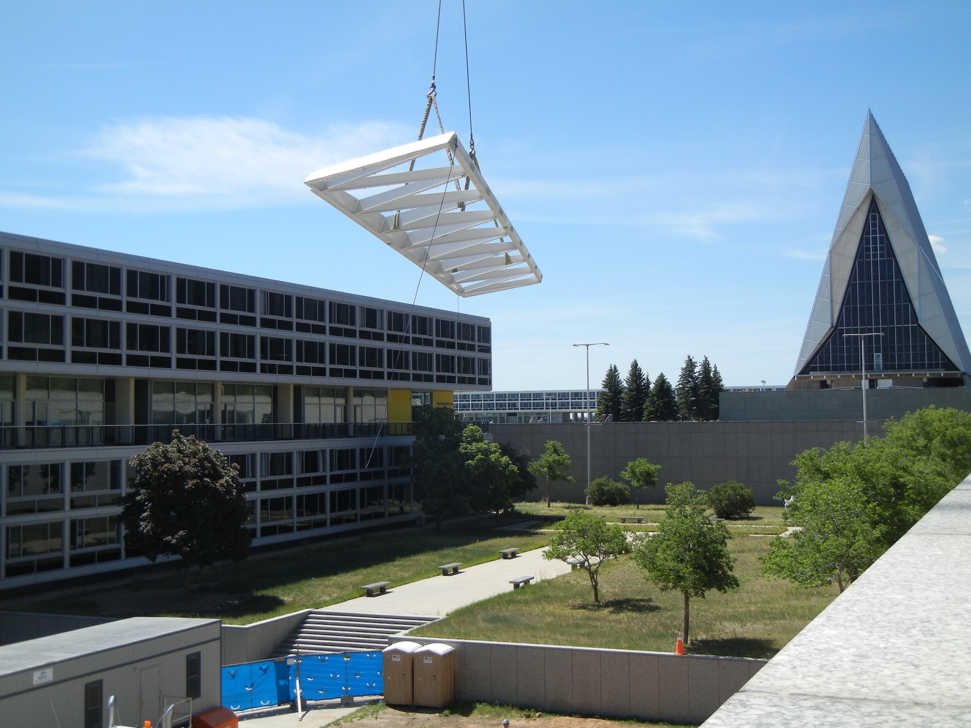 U.S. AIR FORCE ACADEMY, Colo. - The first skylight tower truss is lowered onto the roof deck of the Academy’s Center for Character and Leadership Development, initiating construction of the center’s symbolic glass skylight tower.  (Courtesy photo by ECC)
