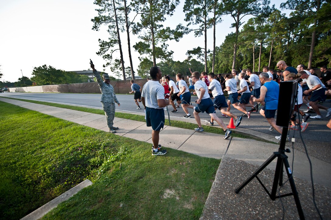 Air Commandos take-off during the Firecracker 5K run on Hurlburt Field, Fla., July 2, 2014. The 1st Special Operations Force Support Squadron hosts monthly themed fun runs on base. (U.S. Air Force photo/Senior Airman Krystal M. Garrett)