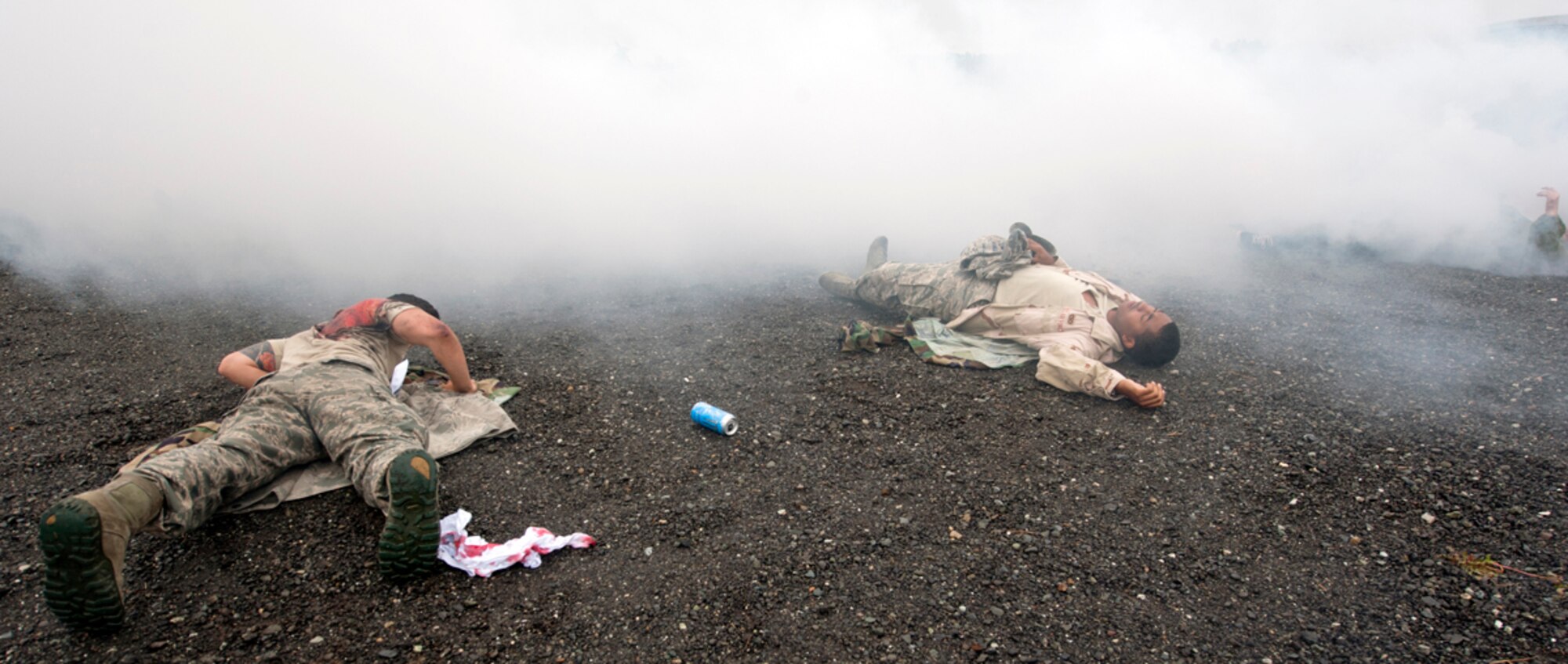 Victims lie on the ground after a simulated explosion during the annual mission assurance exercise on Joint Base Elmendorf-Richardson, Alaska, June 26, 2014. Victims were evacuated from the scene by first responders and treated by medical personnel. Depending on the severity of their wounds, most victims from the simulated explosion were treated immediately and sent to the hospital. (U.S. Air Force photo/Airman 1st Class Tammie Ramsouer)