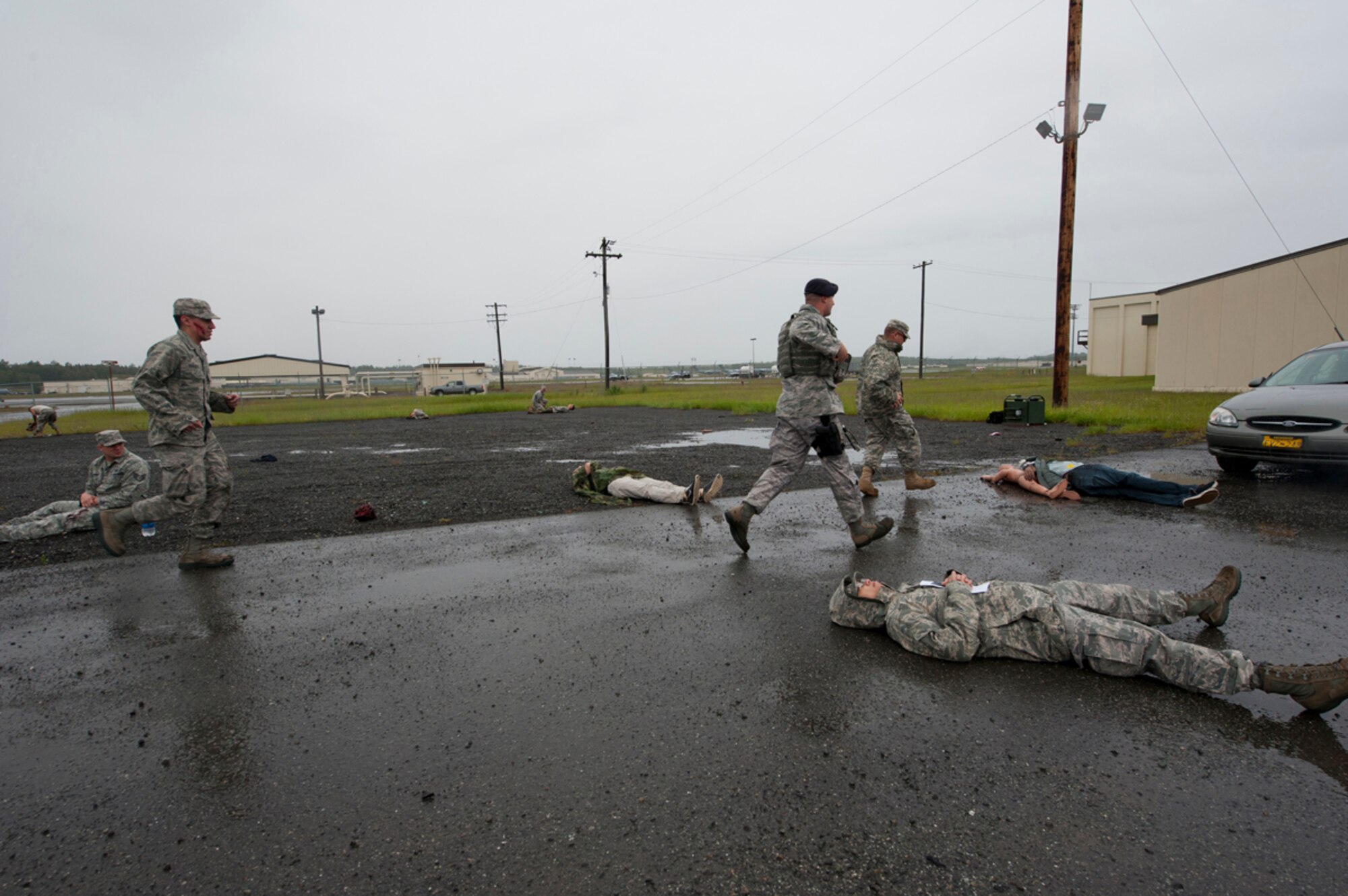 First responders quickly run to victims after a simulated explosion during the annual mission assurance exercise on Joint Base Elmendorf-Richardson, Alaska, June 26, 2014. The explosion was simulated to evaluate how JBER’s first responders quickly triage victims and evacuate them from the blast area. (U.S. Air Force photo/Airman 1st Class Tammie Ramsouer)