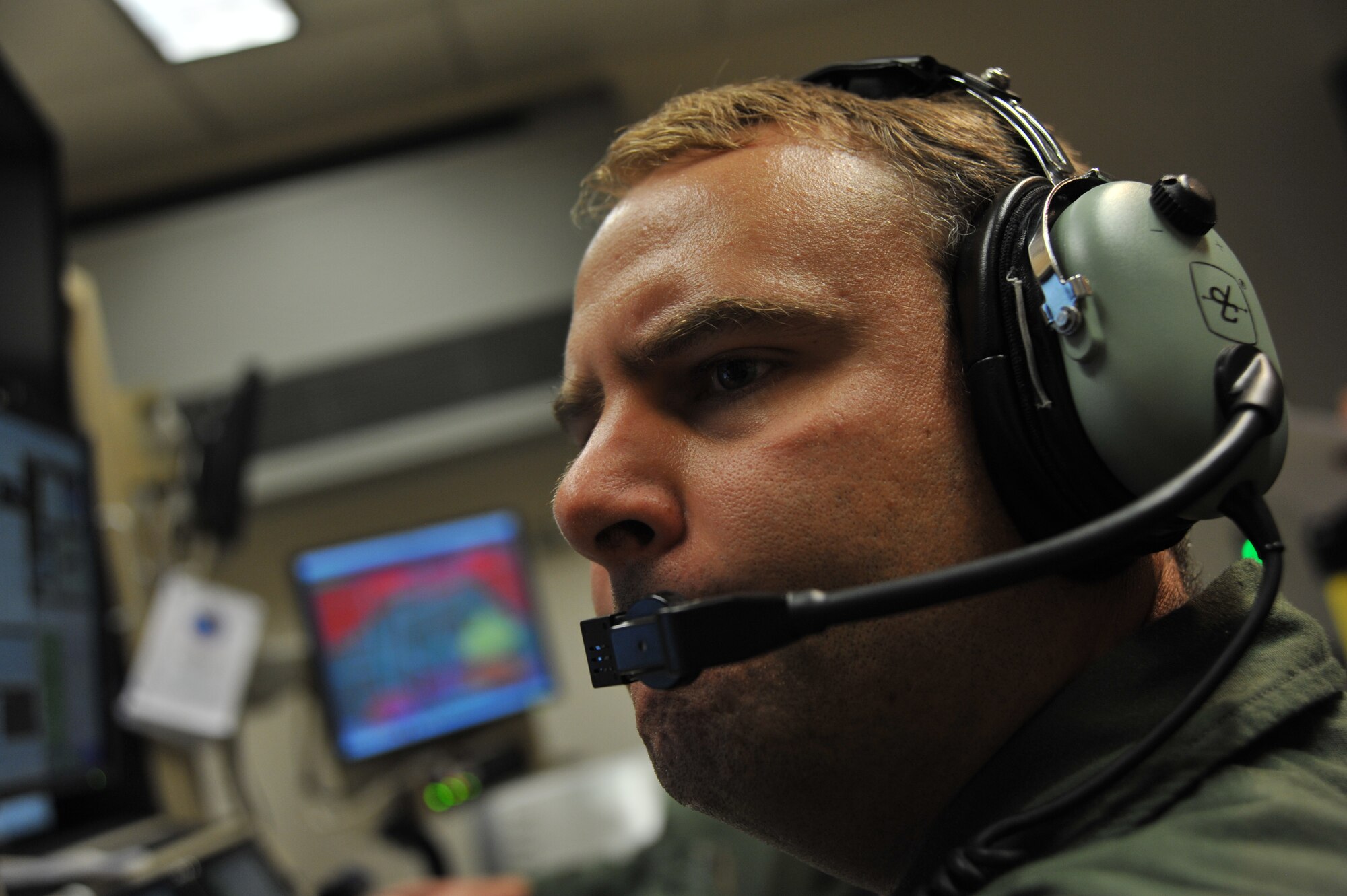 Maj. Seth, MQ-9 Reaper pilot from the 138th Attack Squadron, Syracuse, N.Y., checks flight data during a Wing Hunt mission June 30, 2014, at Creech Air Force Base, Nev. During the competition, remotely piloted aircraft squadron teams were required to formulate a mission plan, evaluate a threat, and develop a strategy to execute the mission effectively. (U.S. Air Force photo by Tech. Sgt. Shad Eidson/Released)