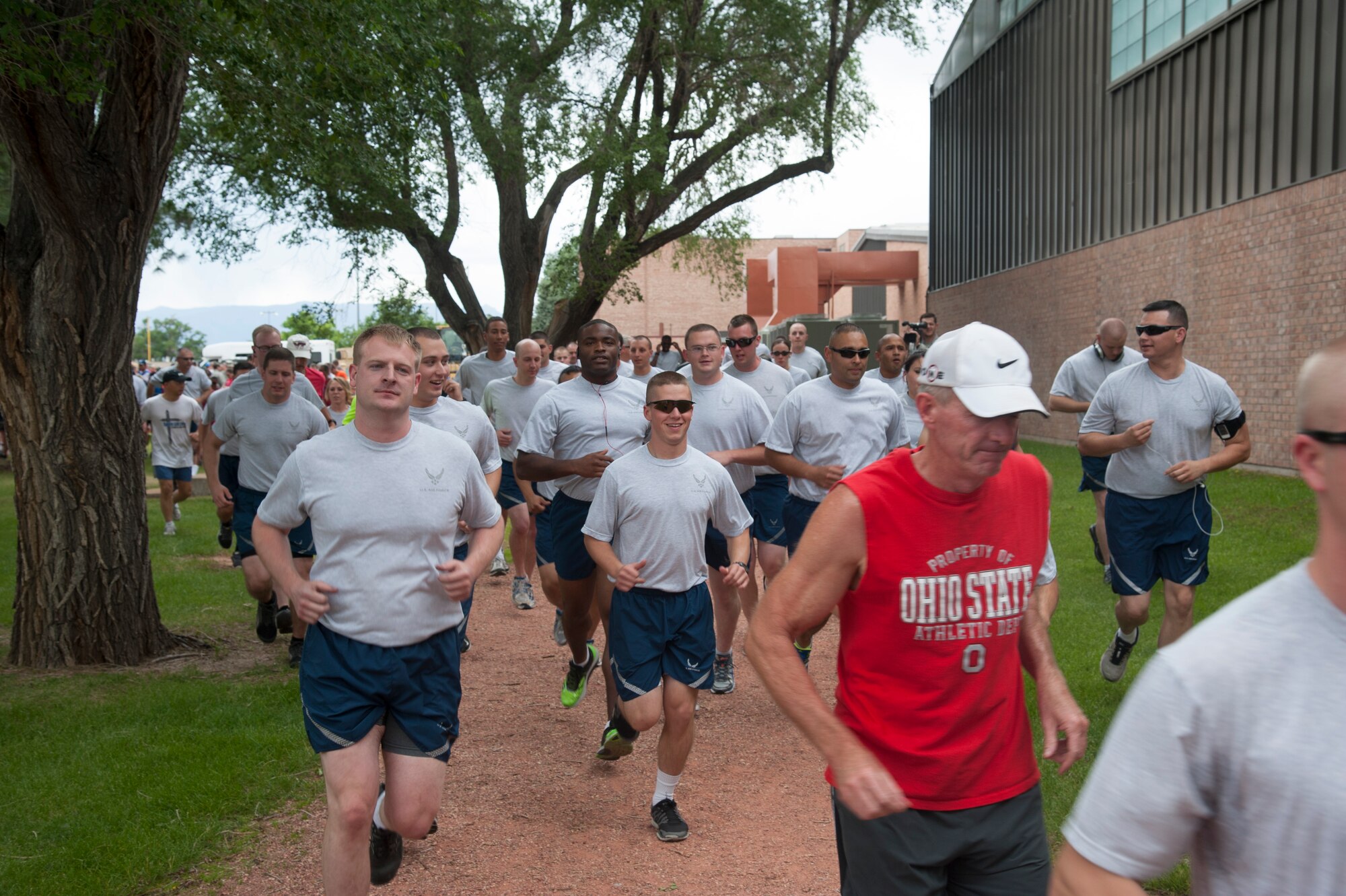 PETERSON AIR FORCE BASE, Colo. – Runners take off on a 5k run after the Capt. David Lyon Memorial Park dedication ceremony June 27 here. Hundreds showed up for the ceremony and a run as Lyon was remembered for his fierce physical fitness standards. (U.S. Air Force photo/Robb Lingley) 