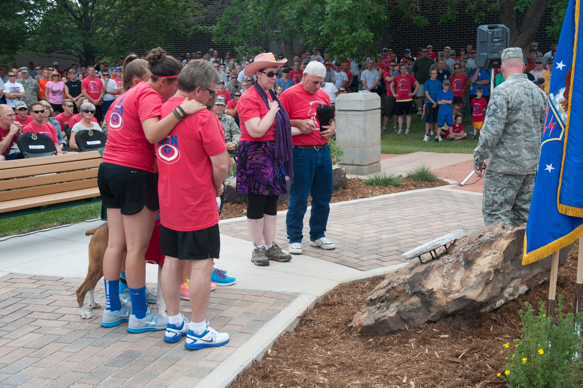 PETERSON AIR FORCE BASE, Colo. – The Lyon and Pounds families see the plaque at Capt. David Lyon Memorial Park for the first time during a ceremony to rename Eagle Park in their son and son-in-law’s honor June 27. Hundreds gathered for the memorial ceremony that was followed by a 5K run. Lyon was killed in action Dec. 27, 2013, in Afghanistan. (U.S. Air Force photo/Robb Lingley)